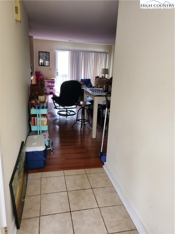116 Grand Boulevard, Unit 1J Boone, NC 28607 - Photo 2 of 17 a living room with furniture and a window
