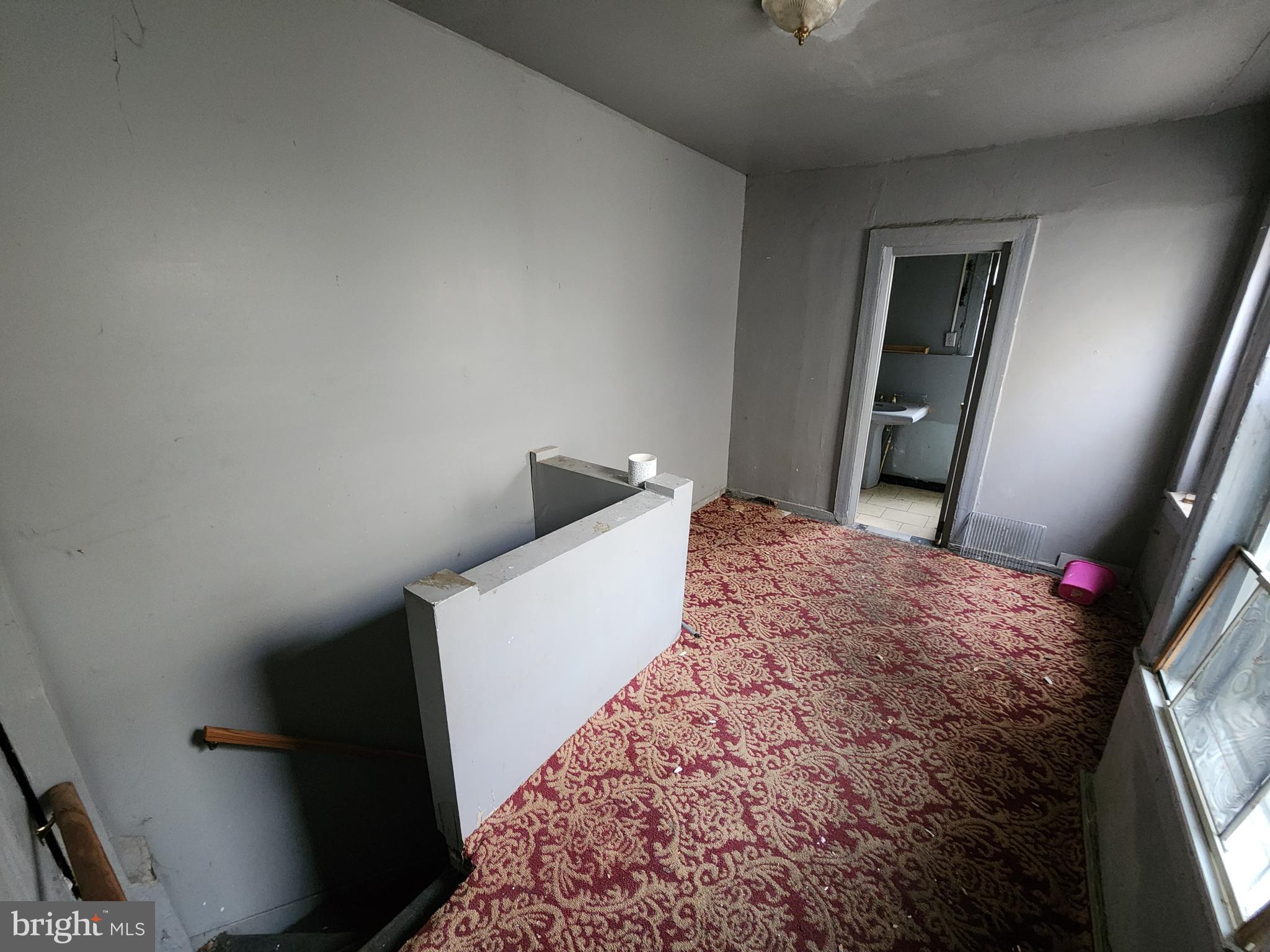 526 North Chester Street Baltimore, MD 21205 - Photo 14 of 26 a bedroom with a bed and a mirror