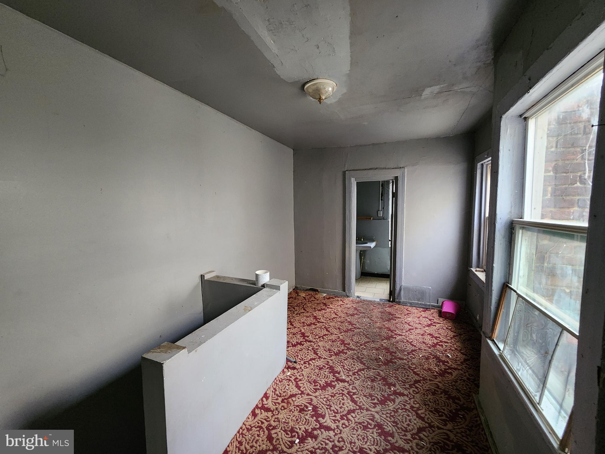 526 North Chester Street Baltimore, MD 21205 - Photo 15 of 26 a bed room with a bed