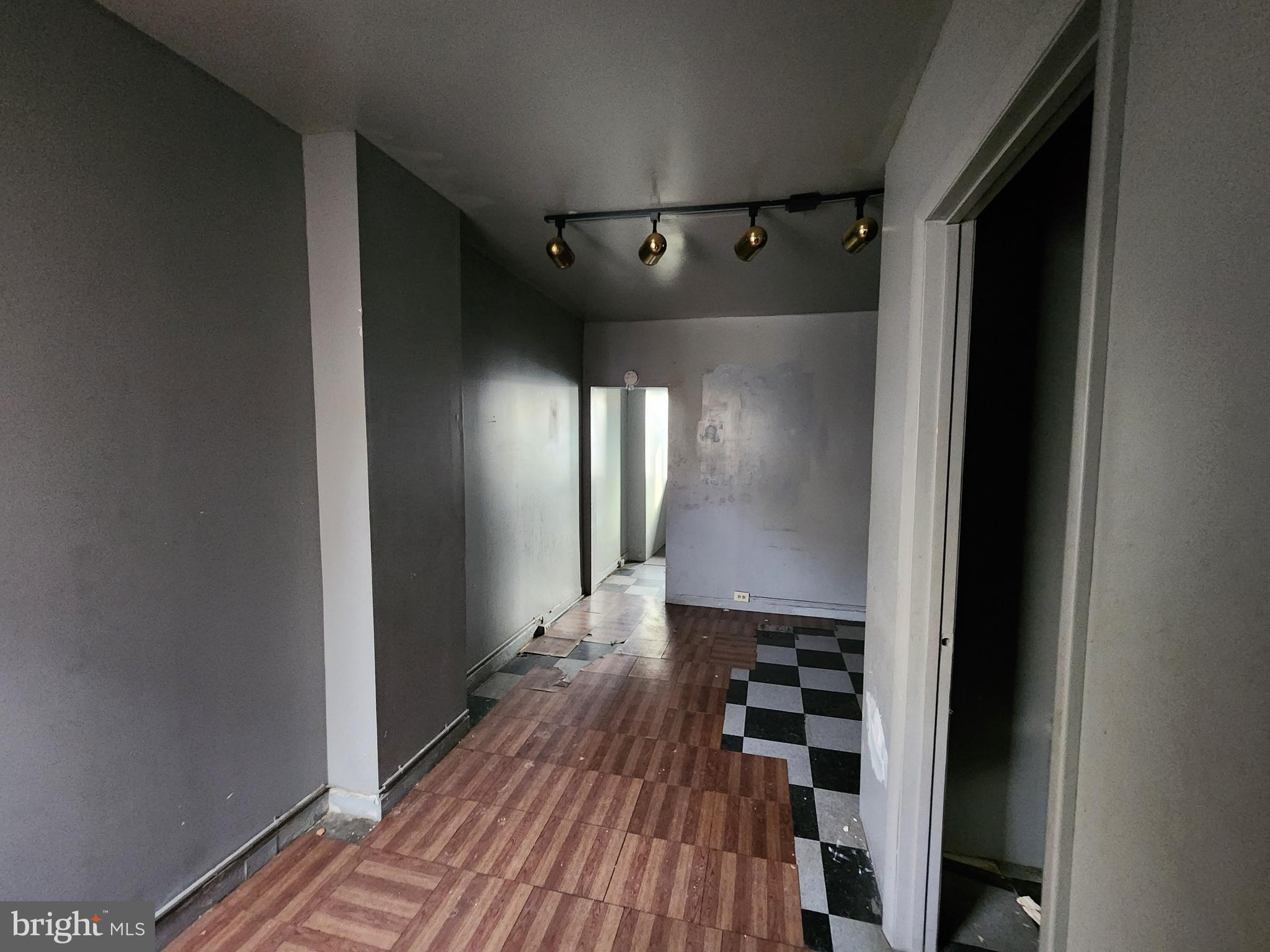 526 North Chester Street Baltimore, MD 21205 - Photo 16 of 26 a view of a hallway with wooden floor and staircase