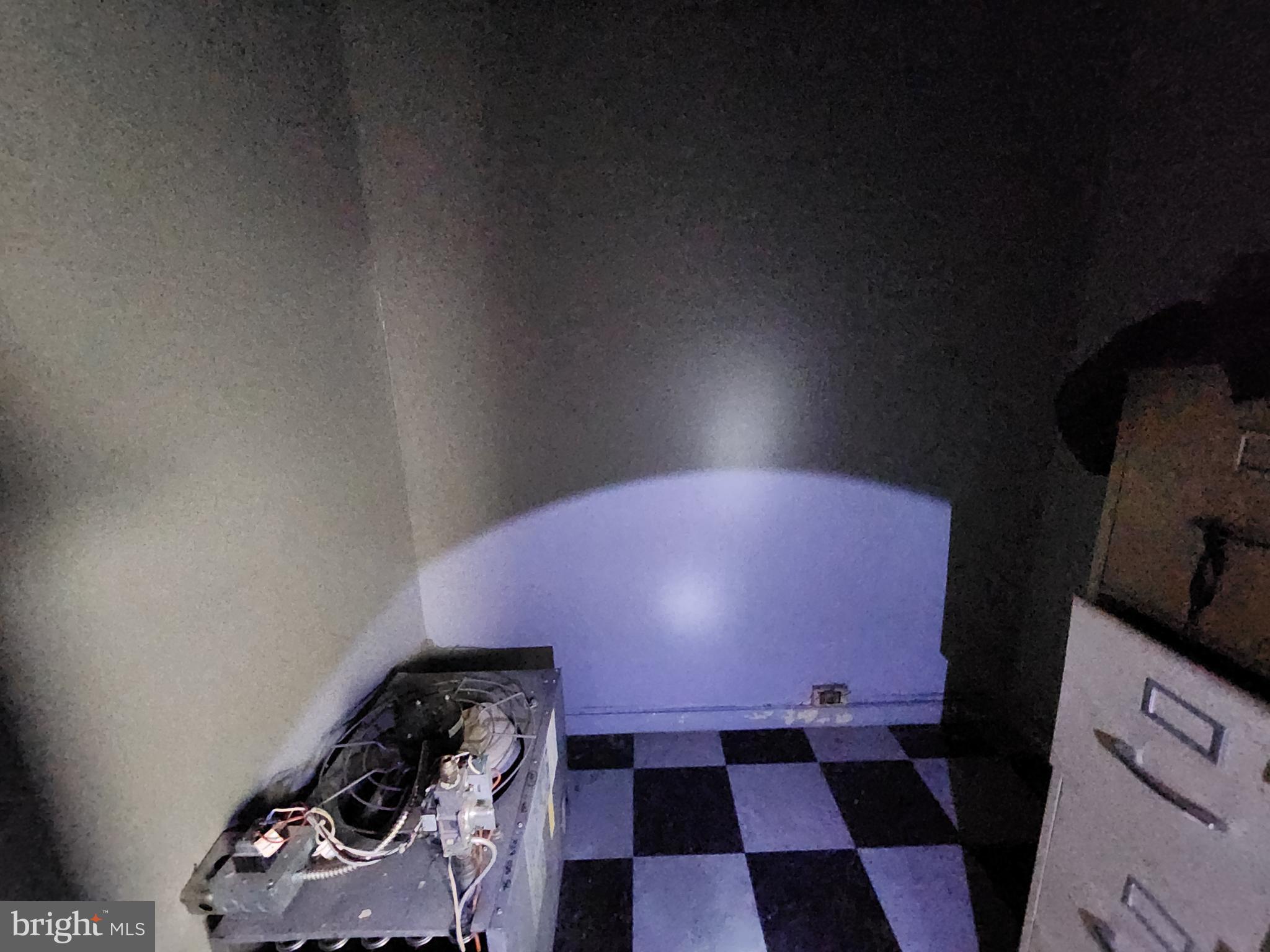 526 North Chester Street Baltimore, MD 21205 - Photo 17 of 26 a very nice looking room with a black and white checkered floor