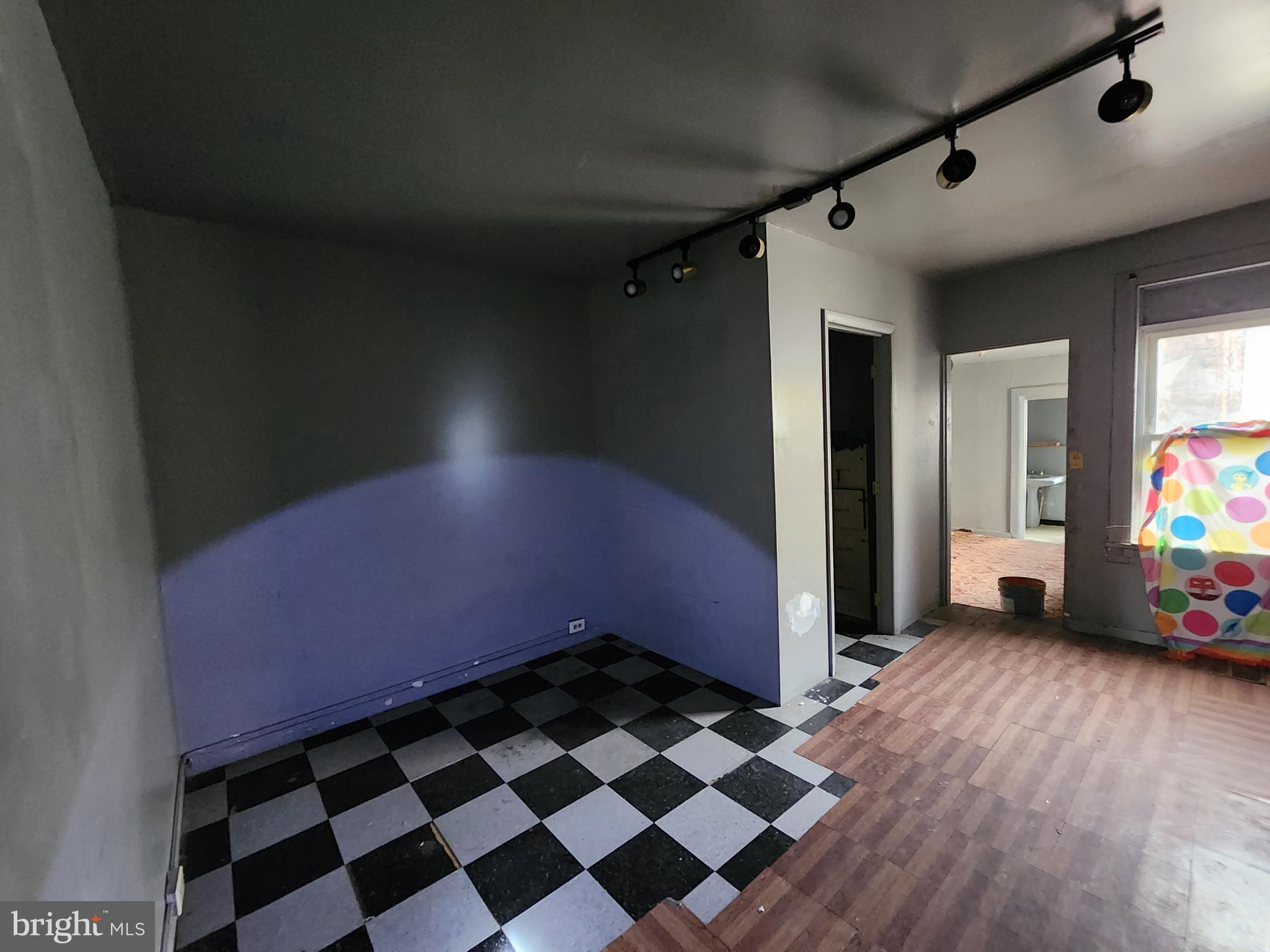 526 North Chester Street Baltimore, MD 21205 - Photo 19 of 26 a view of a livingroom with a black and white checkered floor