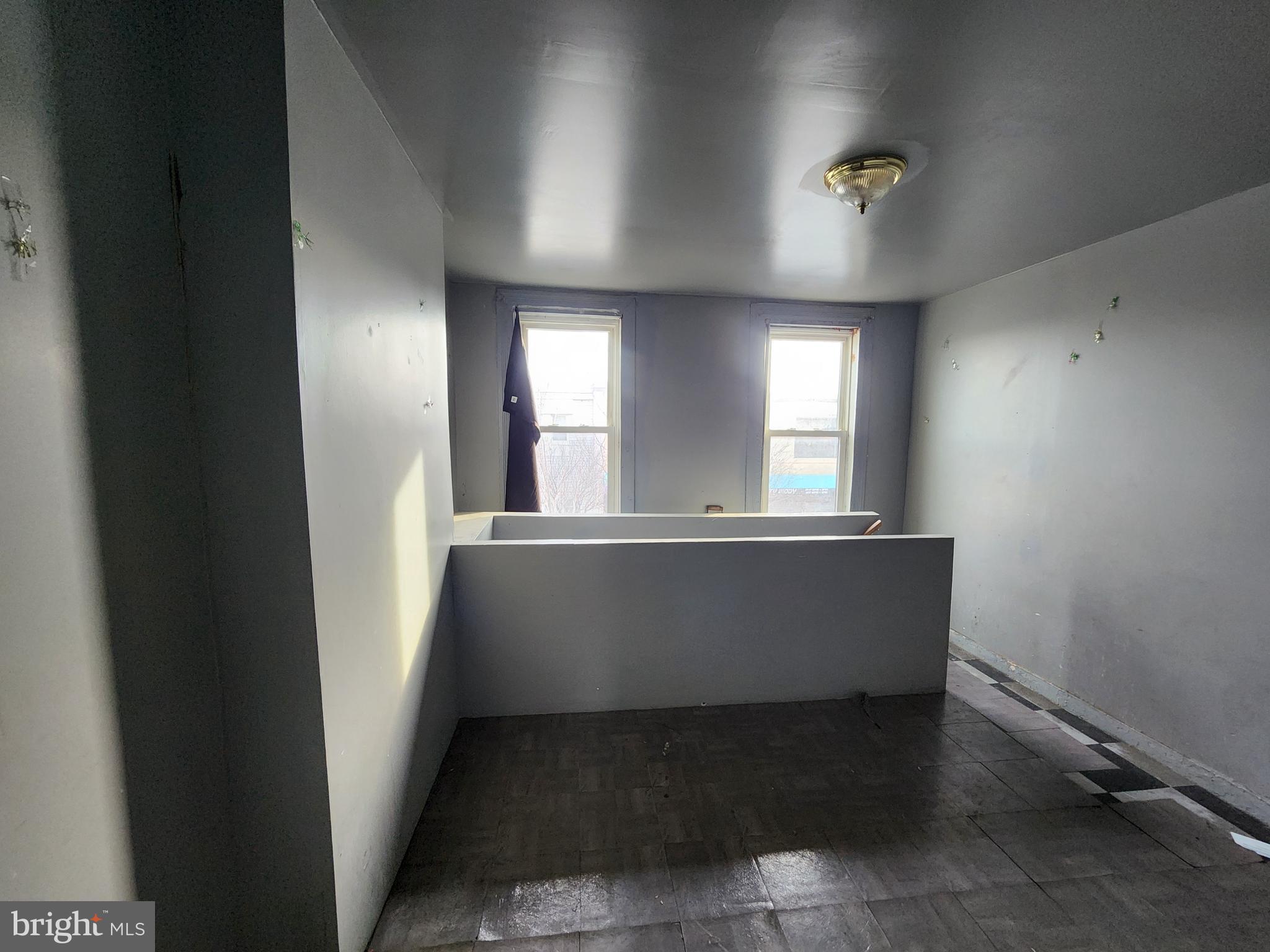 526 North Chester Street Baltimore, MD 21205 - Photo 20 of 26 an empty room with windows