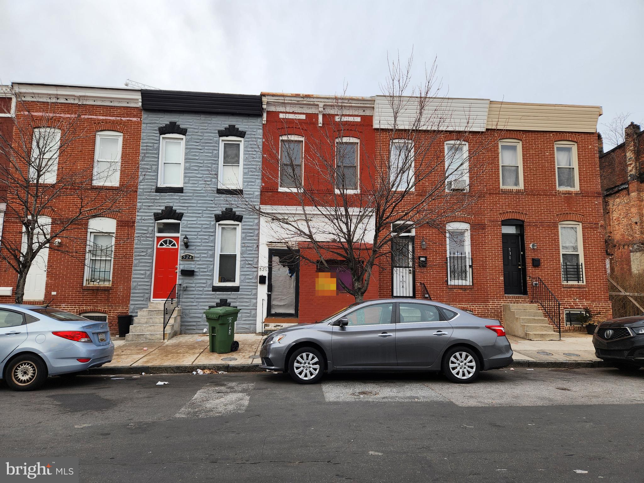 526 North Chester Street Baltimore, MD 21205 - Photo 2 of 26 a car parked in front of a building