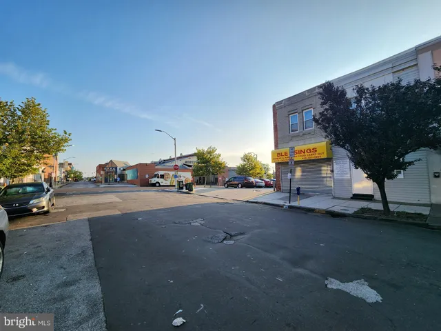 a view of street with parked cars