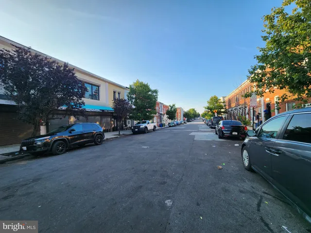 a view of street with parked cars