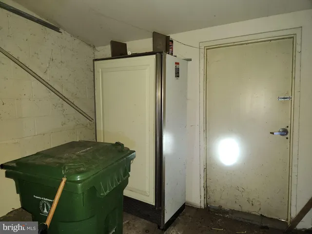 a bathroom with a shower and a door