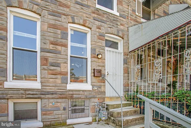 a front view of a building with glass windows