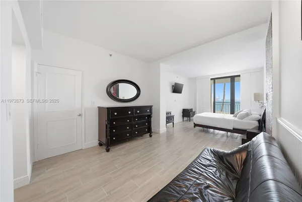 a living room with furniture and a rug