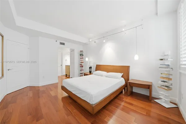 a bedroom with a bed and a closet