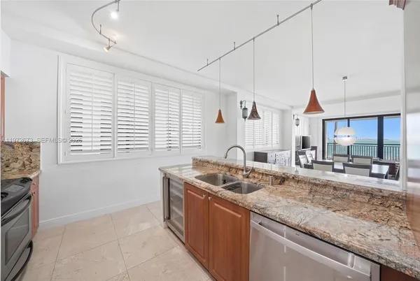 a kitchen with granite countertop a sink and a counter