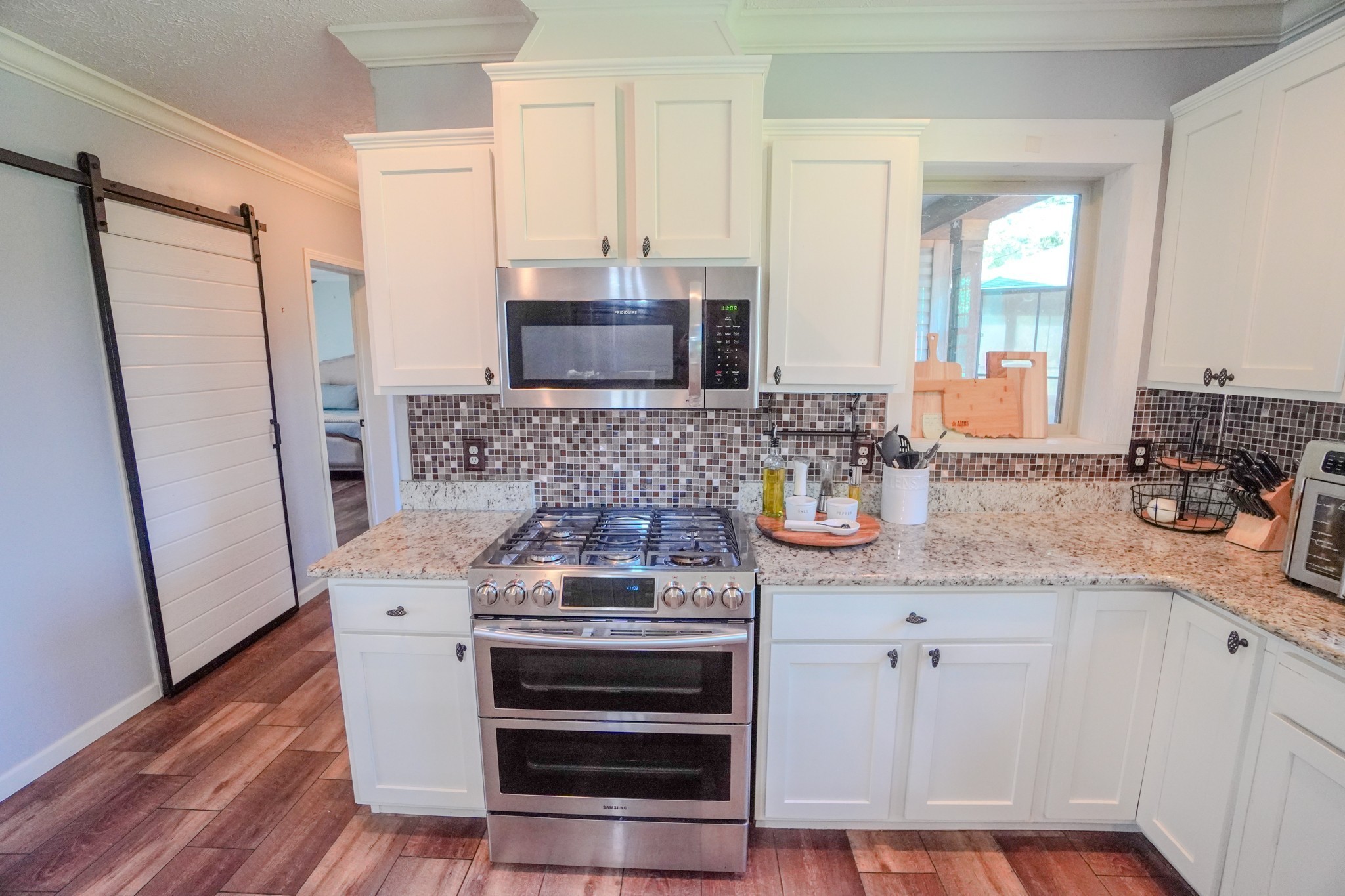137 Hawkins Road Westmoreland, TN 37186 - Photo 32 of 70 a kitchen with stainless steel appliances a stove a sink and a refrigerator