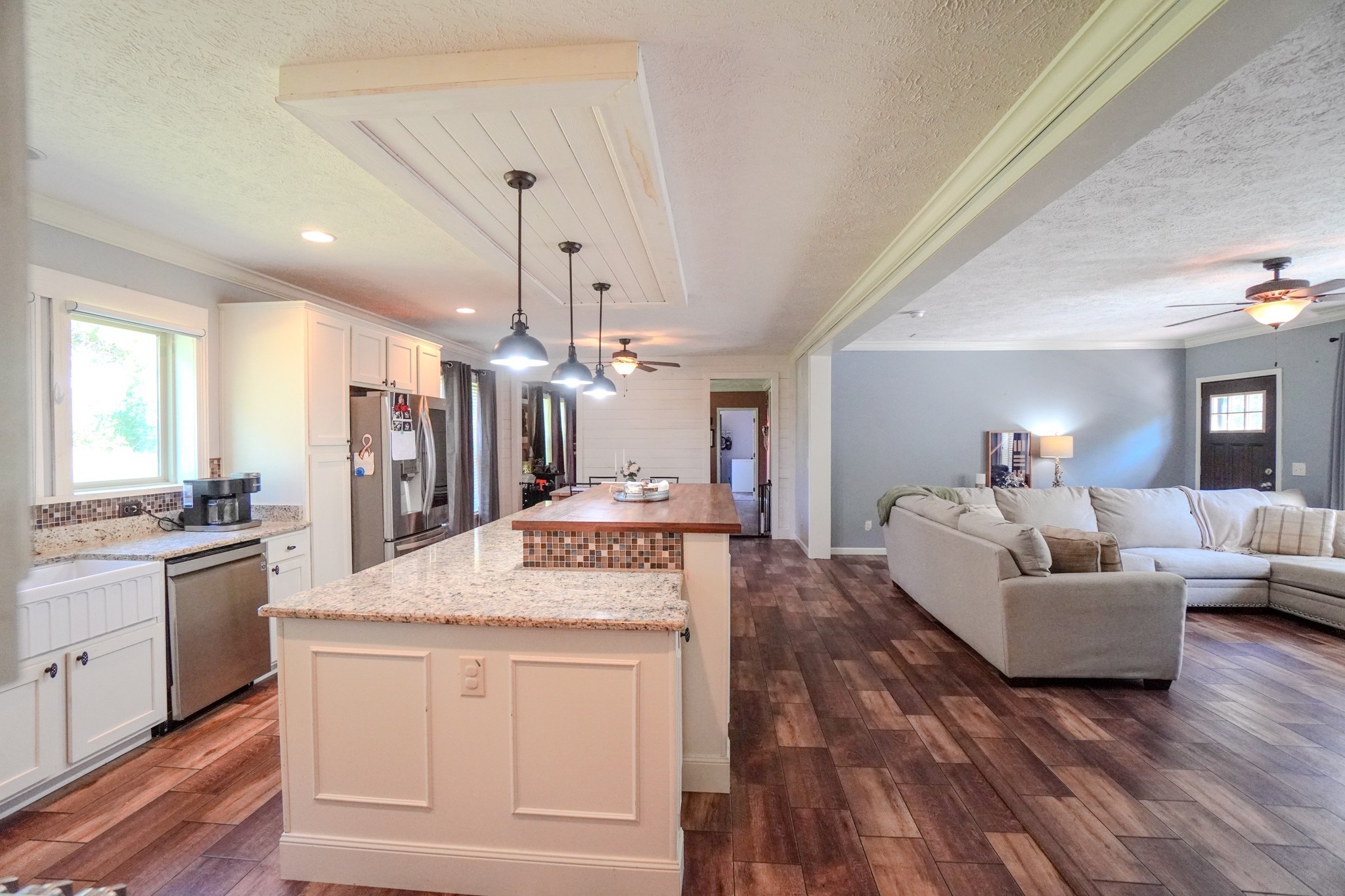 137 Hawkins Road Westmoreland, TN 37186 - Photo 35 of 70 a open kitchen with stainless steel appliances granite countertop a stove and a refrigerator