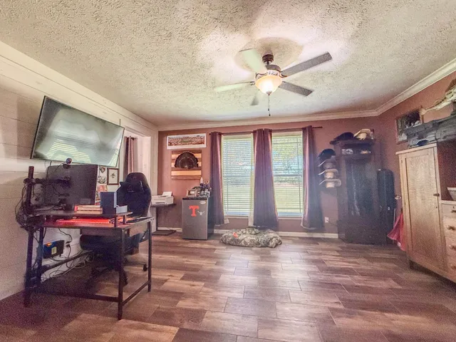 a bedroom with a bed and couch