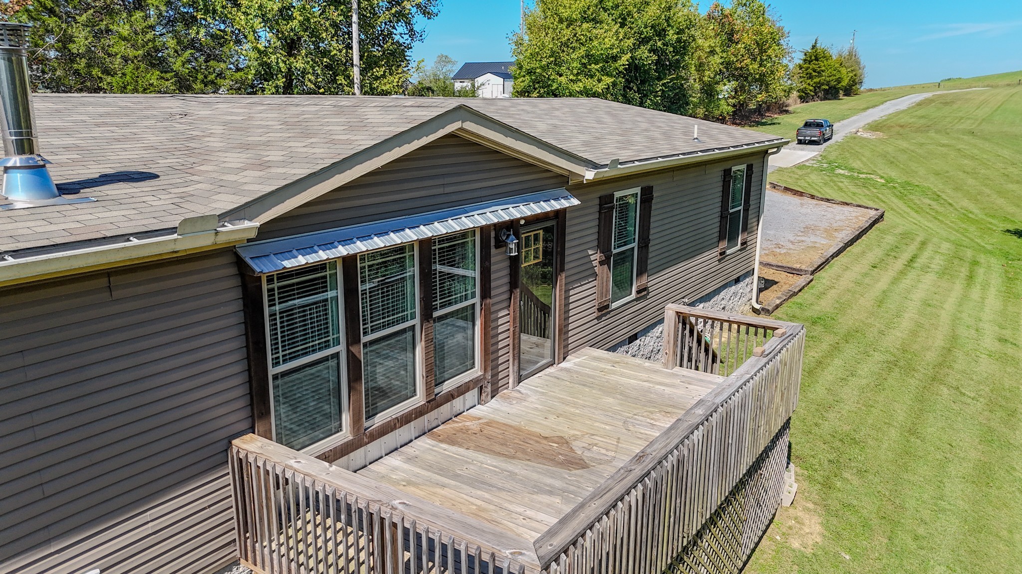 137 Hawkins Road Westmoreland, TN 37186 - Photo 6 of 70 a roof deck with table and chairs