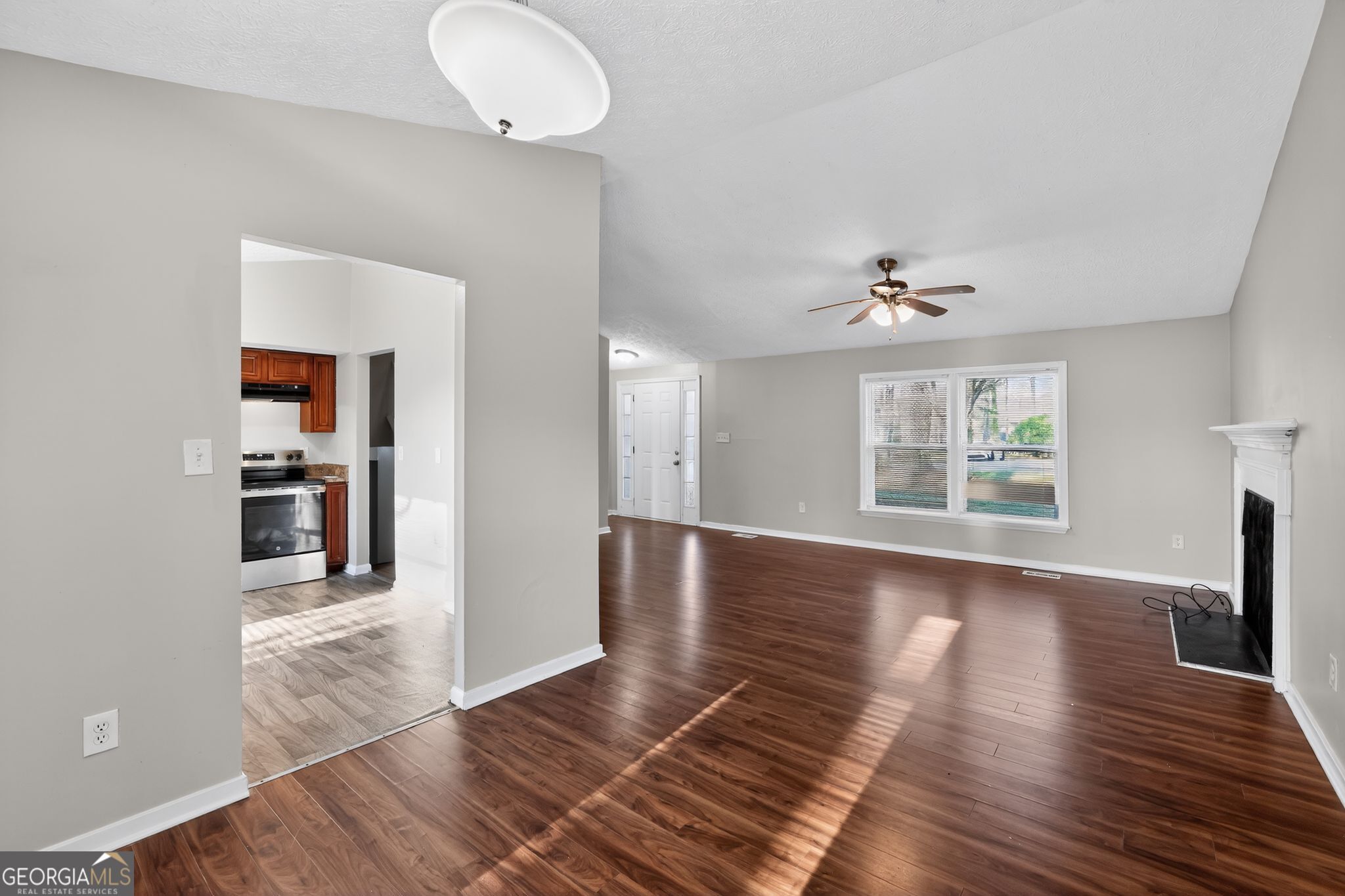 3798 Radcliffe Boulevard Decatur, GA 30034 - Photo 15 of 32 wooden floor in an empty room with a window