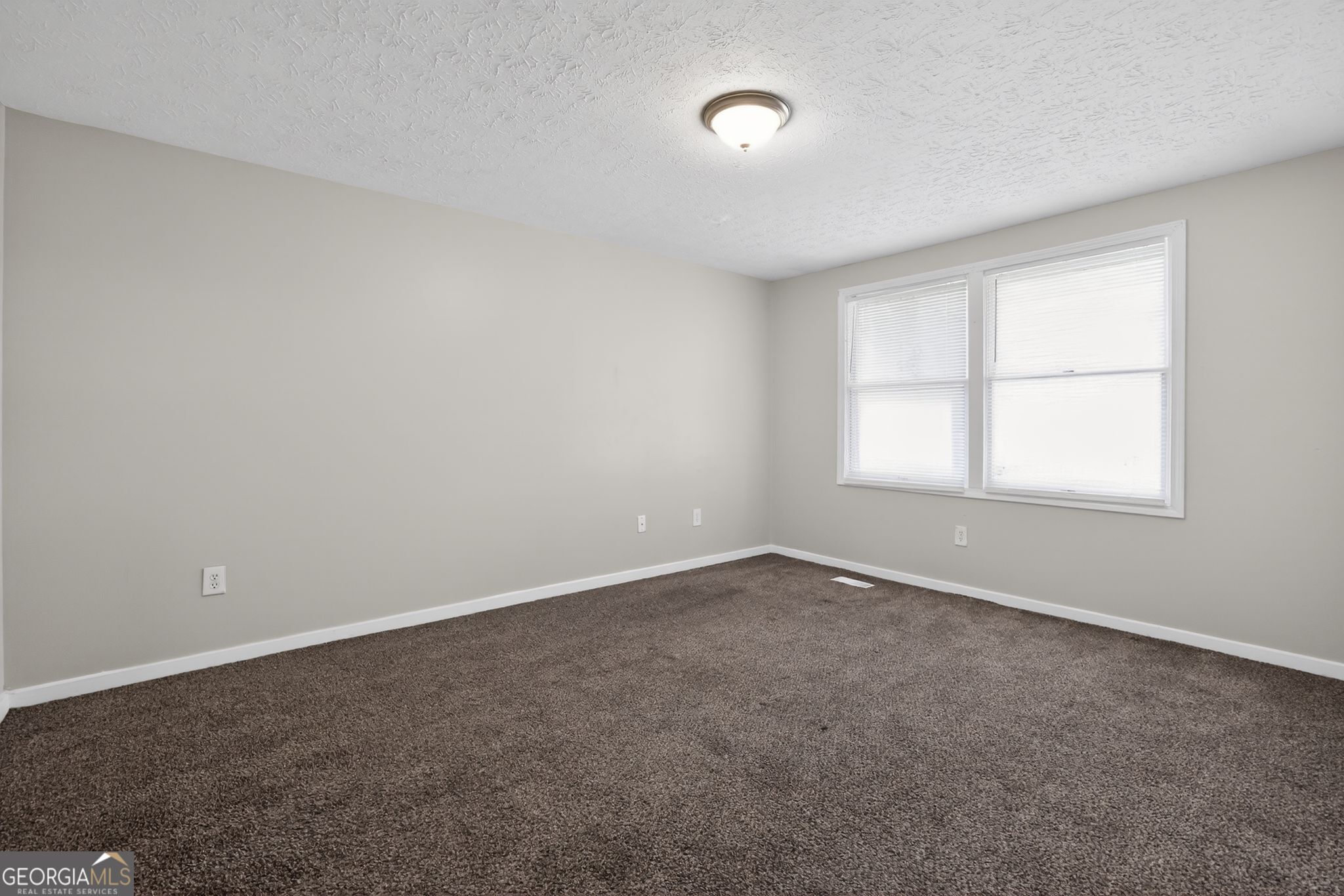 3798 Radcliffe Boulevard Decatur, GA 30034 - Photo 16 of 32 an empty room with a window