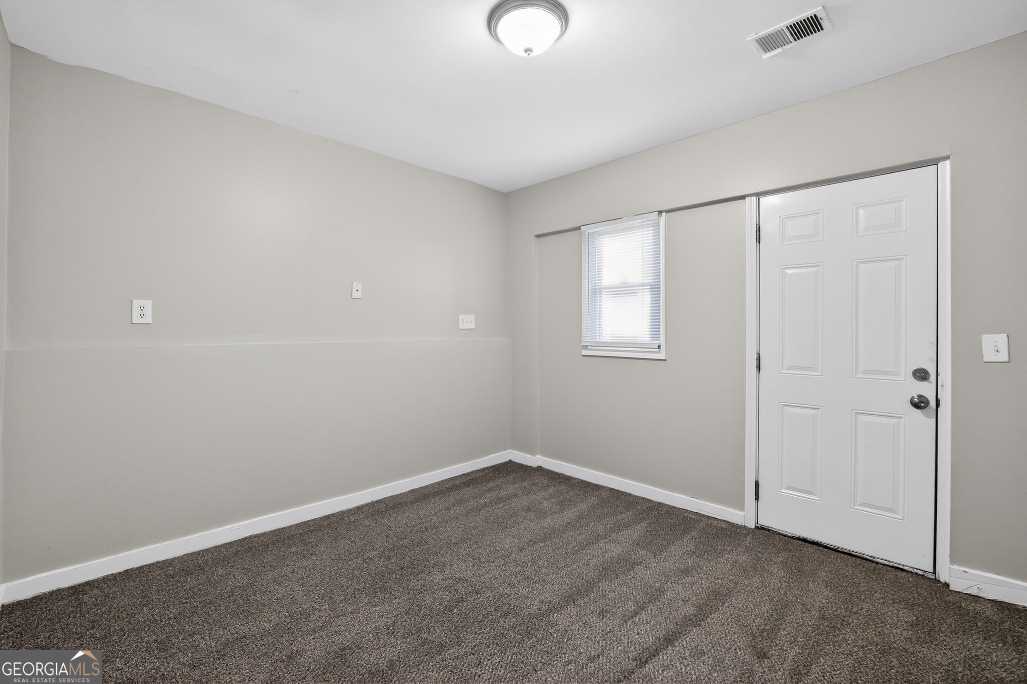 3798 Radcliffe Boulevard Decatur, GA 30034 - Photo 17 of 32 a view of an empty room with a window
