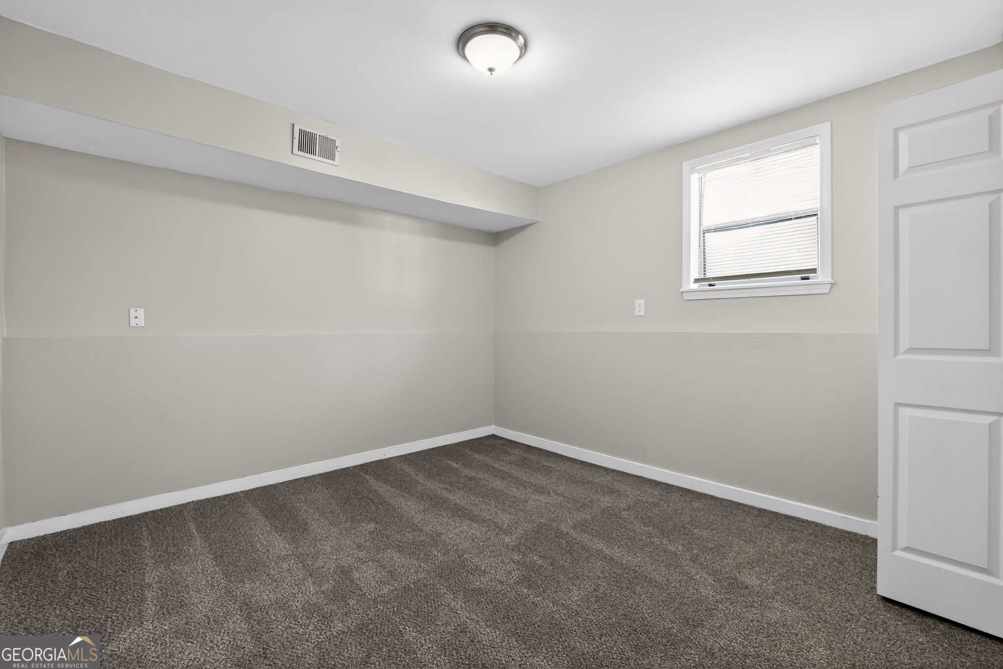 3798 Radcliffe Boulevard Decatur, GA 30034 - Photo 18 of 32 an empty room with windows and closet