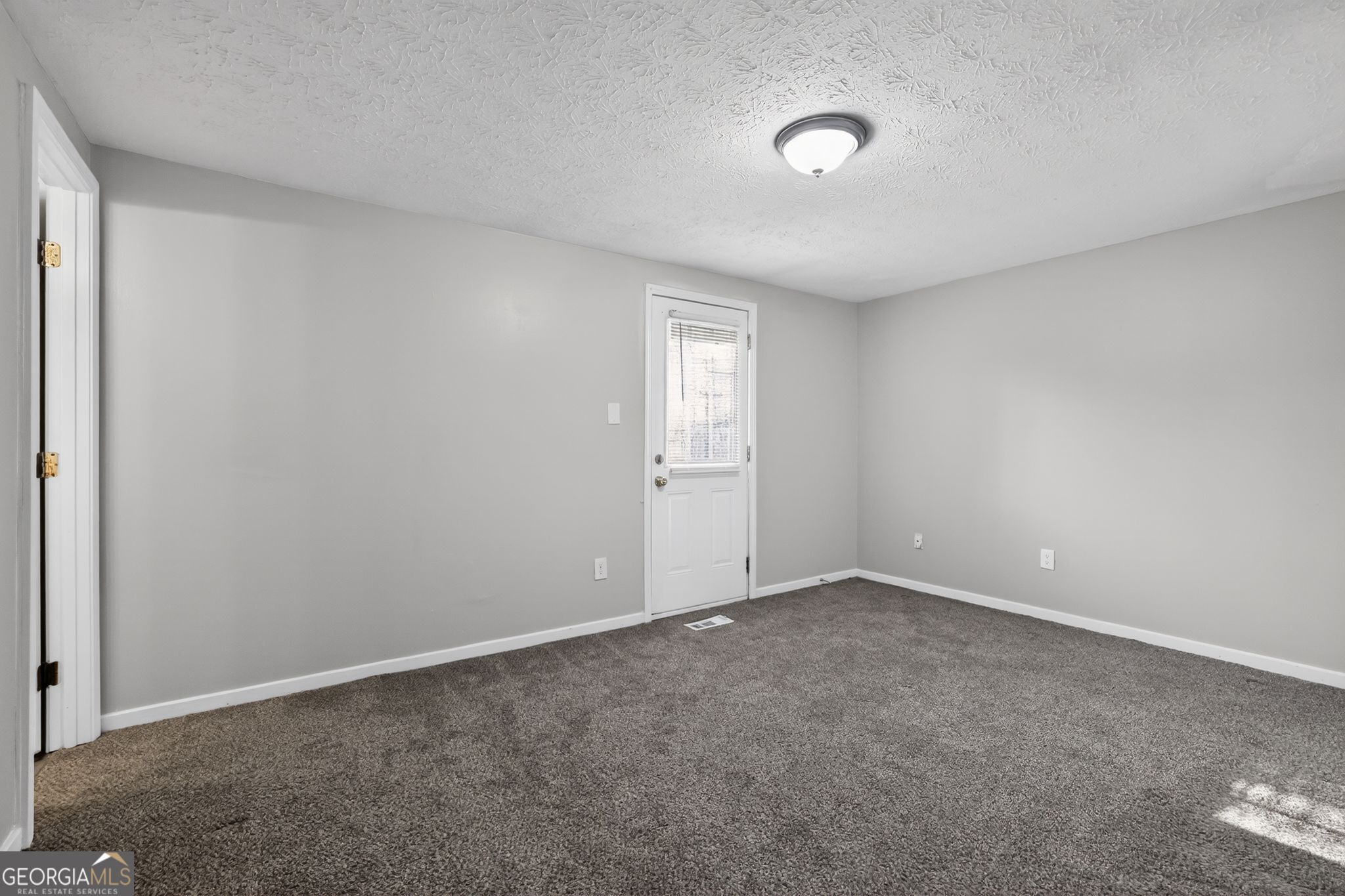 3798 Radcliffe Boulevard Decatur, GA 30034 - Photo 20 of 32 an empty room with windows and closet