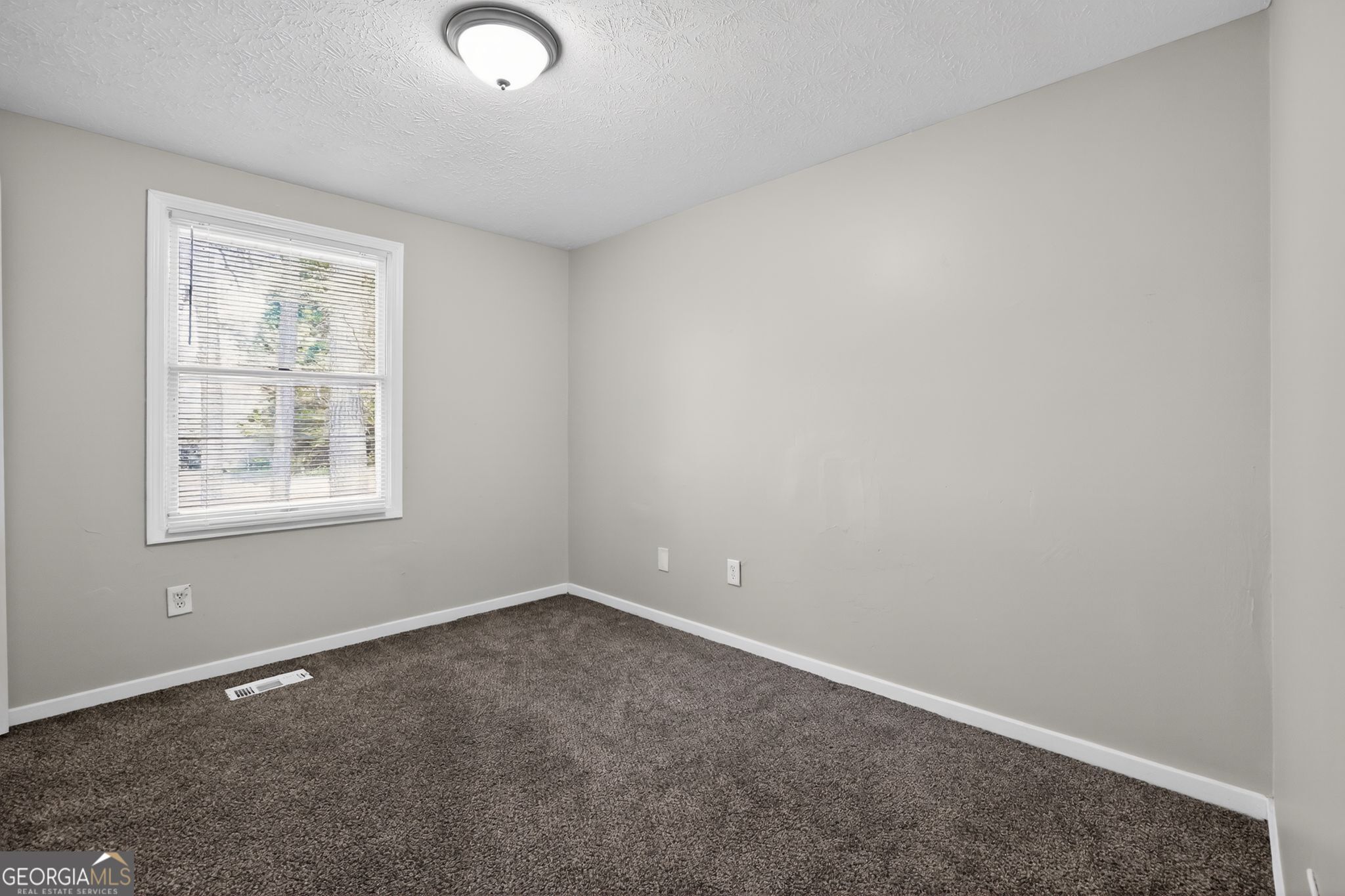3798 Radcliffe Boulevard Decatur, GA 30034 - Photo 21 of 32 an empty room with windows