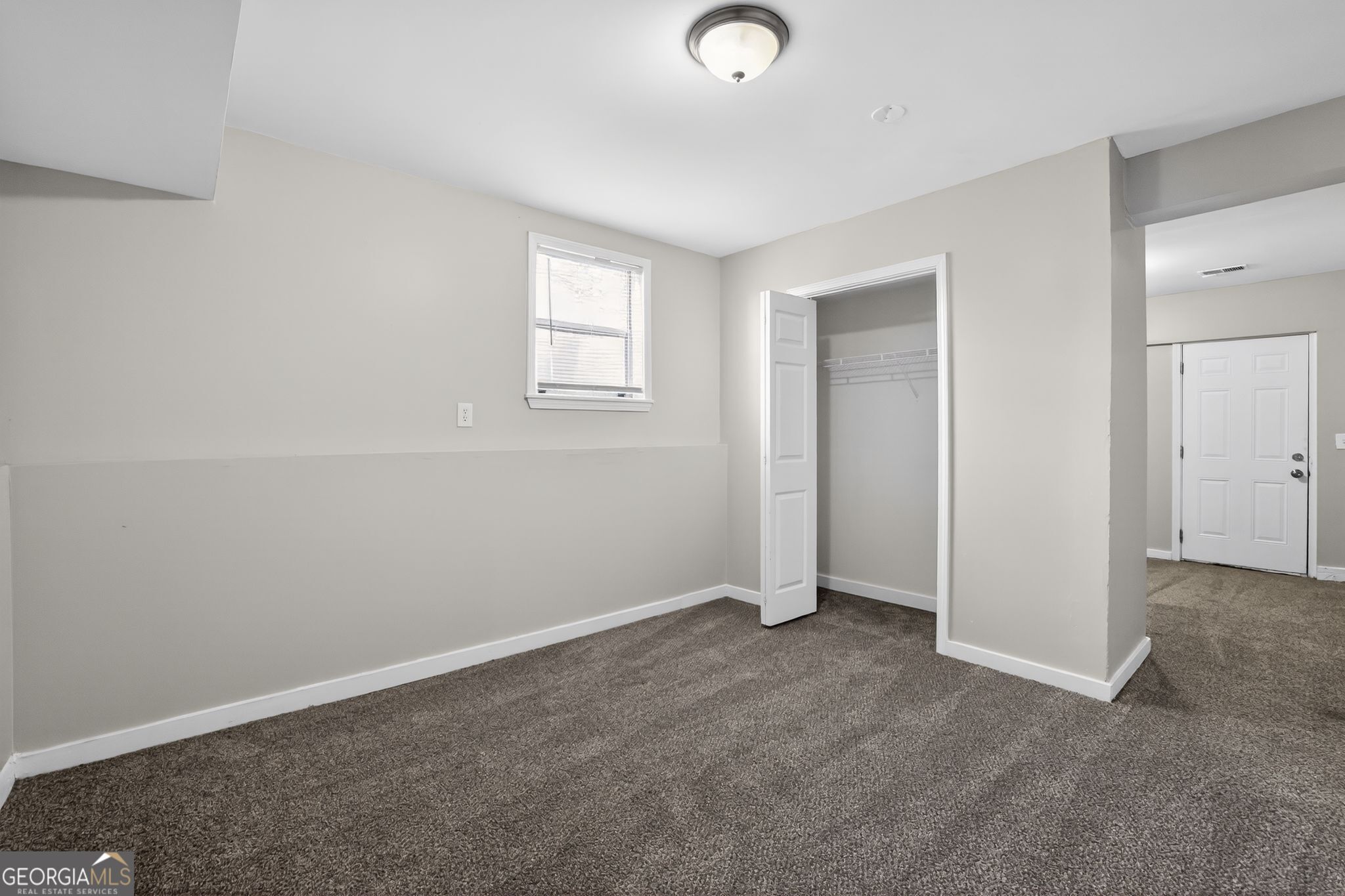 3798 Radcliffe Boulevard Decatur, GA 30034 - Photo 24 of 32 an empty room with windows