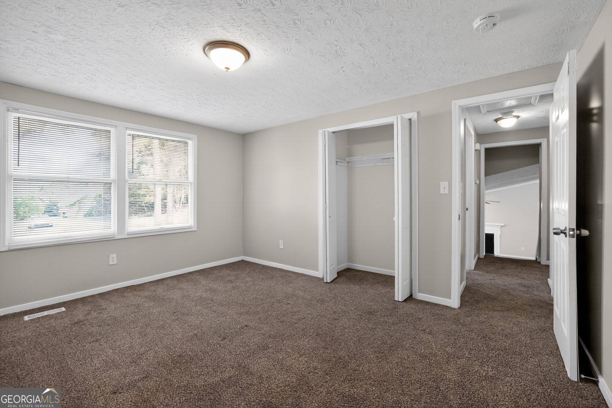 3798 Radcliffe Boulevard Decatur, GA 30034 - Photo 25 of 32 an empty room with windows and closet