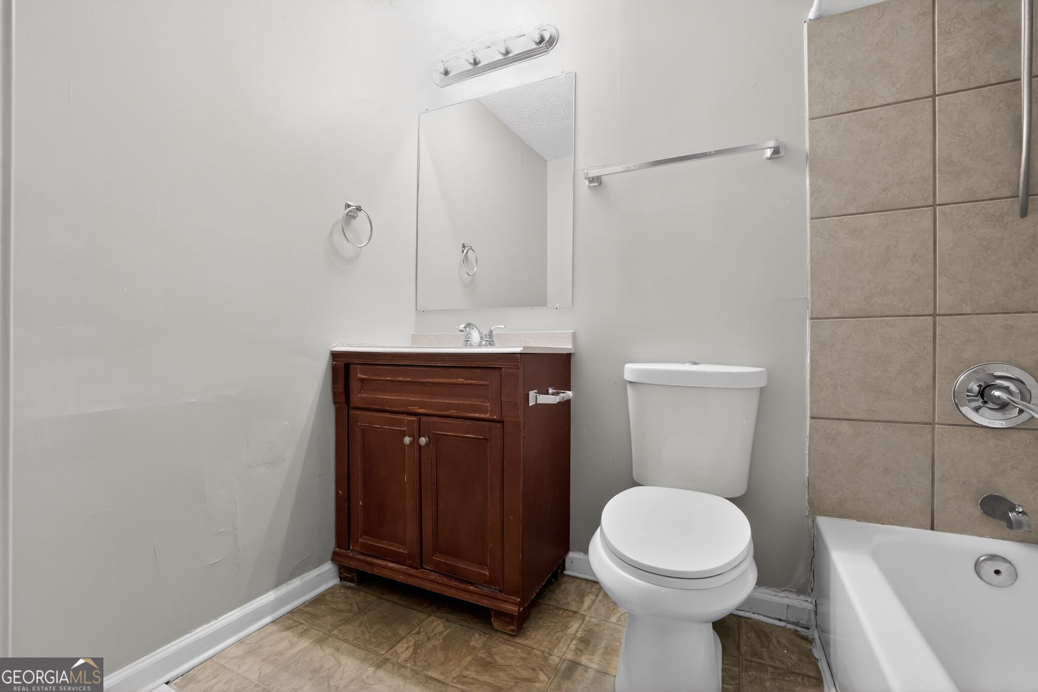 3798 Radcliffe Boulevard Decatur, GA 30034 - Photo 27 of 32 a bathroom with a sink a toilet and shower