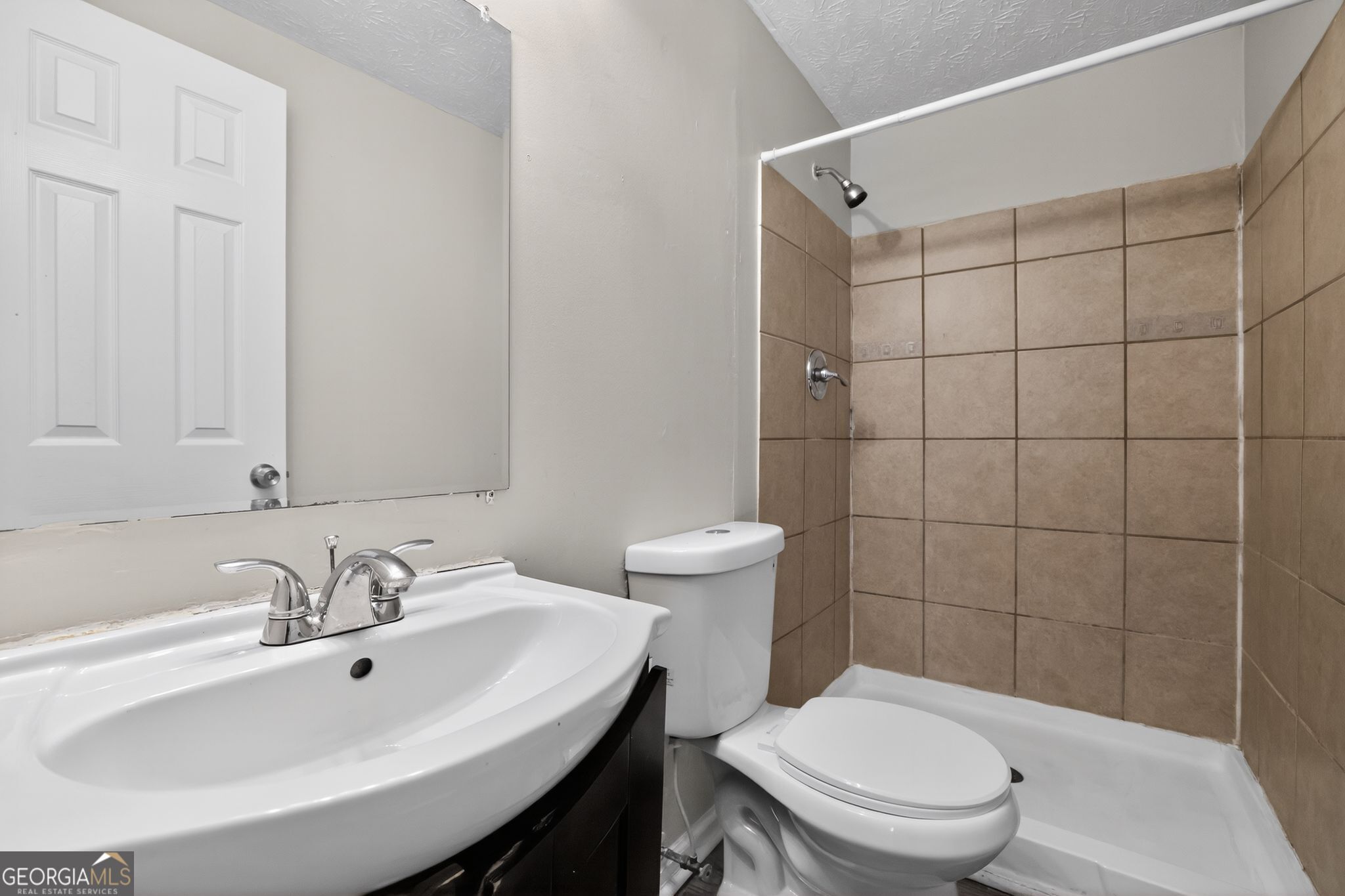 3798 Radcliffe Boulevard Decatur, GA 30034 - Photo 28 of 32 a bathroom with a sink a toilet and shower