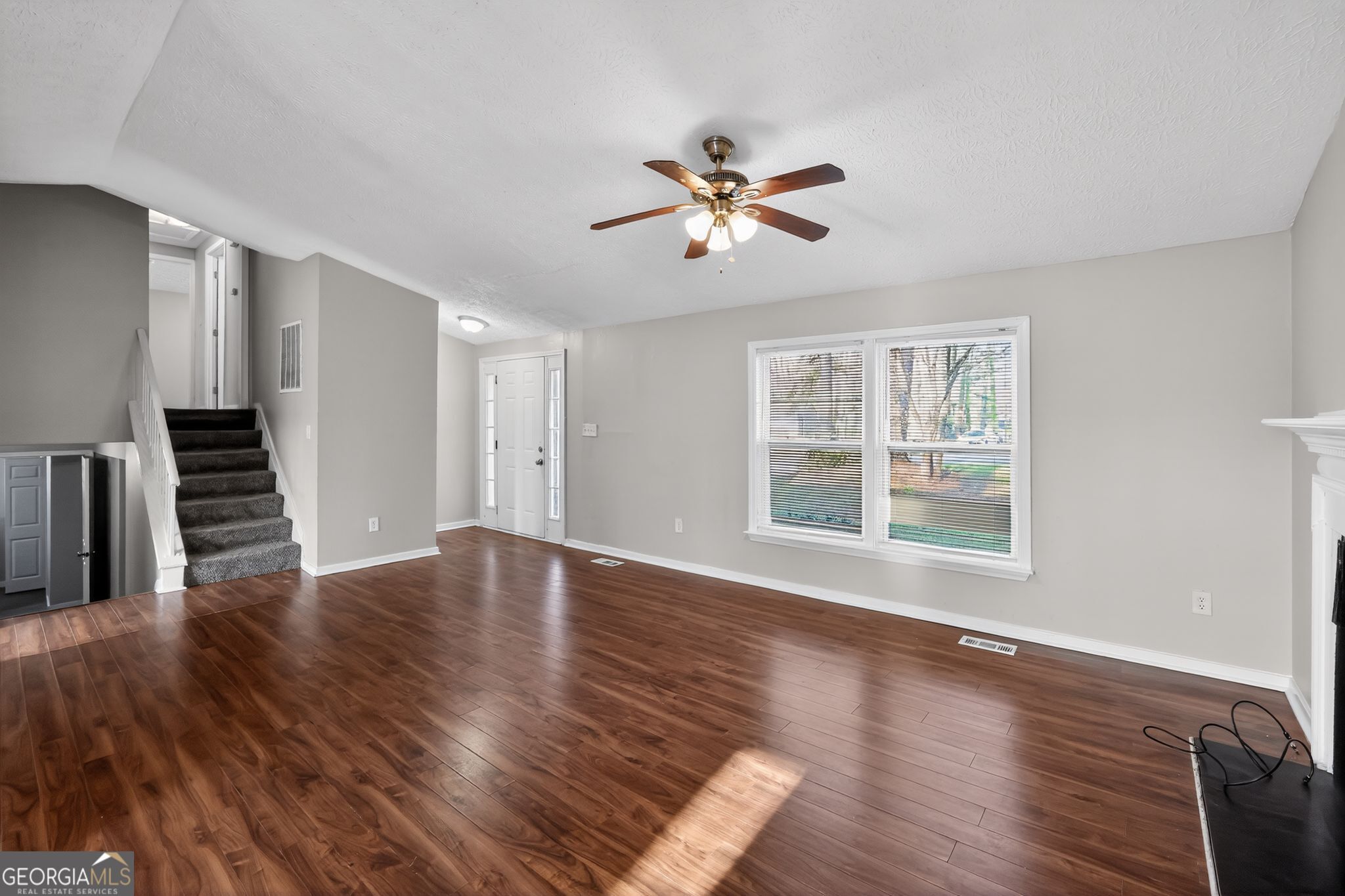 3798 Radcliffe Boulevard Decatur, GA 30034 - Photo 7 of 32 a view of empty room with wooden floor and fan