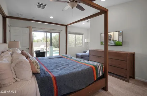 a bedroom with a bed and window
