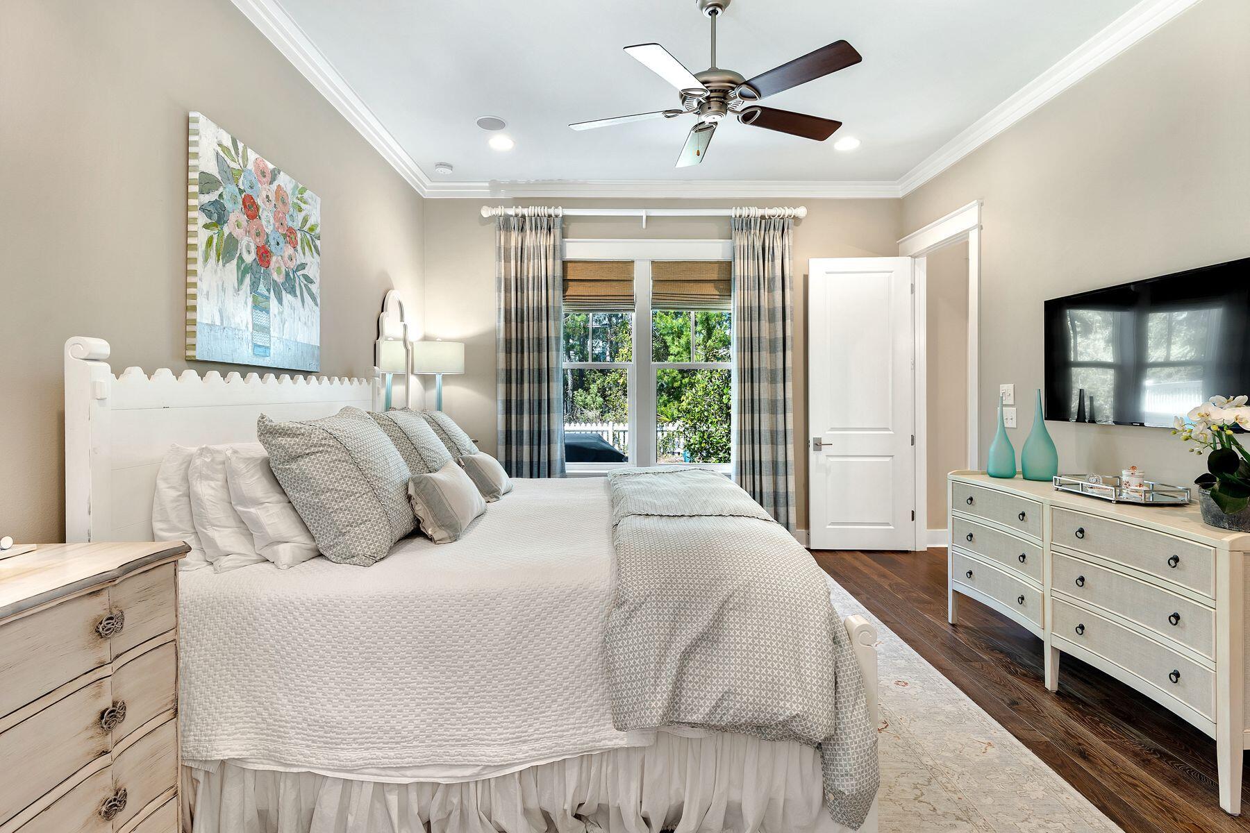 150 Medley Street Watersound, FL 32461 - Photo 12 of 30 a bedroom with a large bed and a window