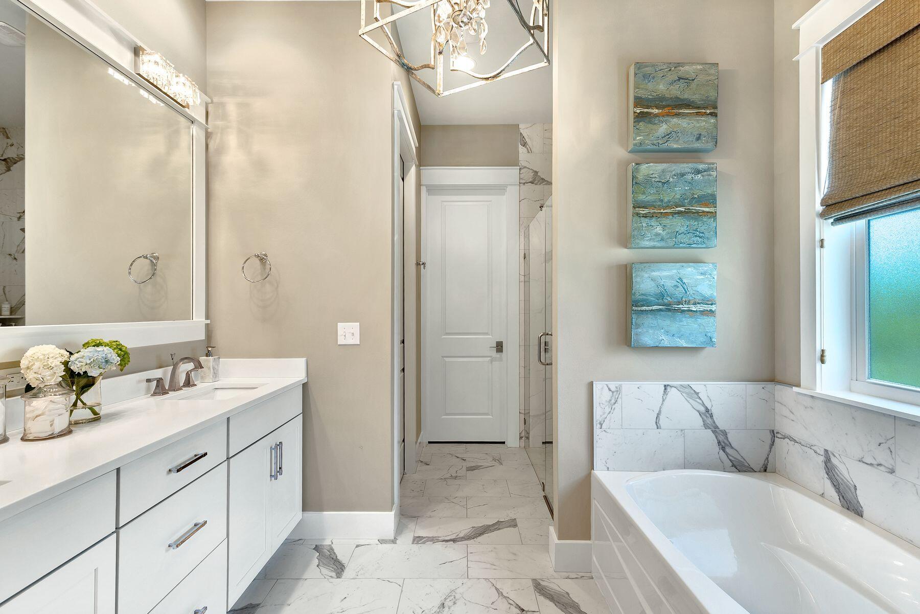150 Medley Street Watersound, FL 32461 - Photo 13 of 30 a spacious bathroom with a tub sink and mirror