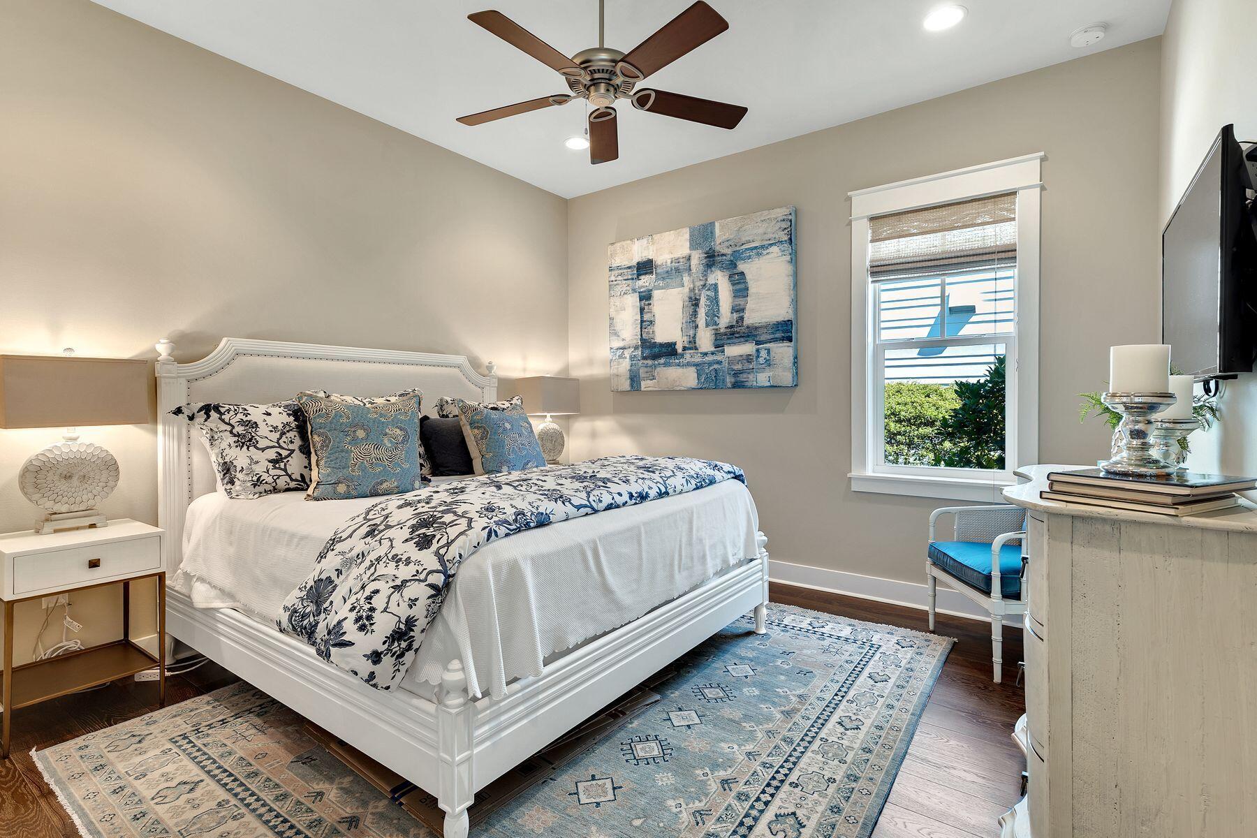 150 Medley Street Watersound, FL 32461 - Photo 15 of 30 a bedroom with a bed and window