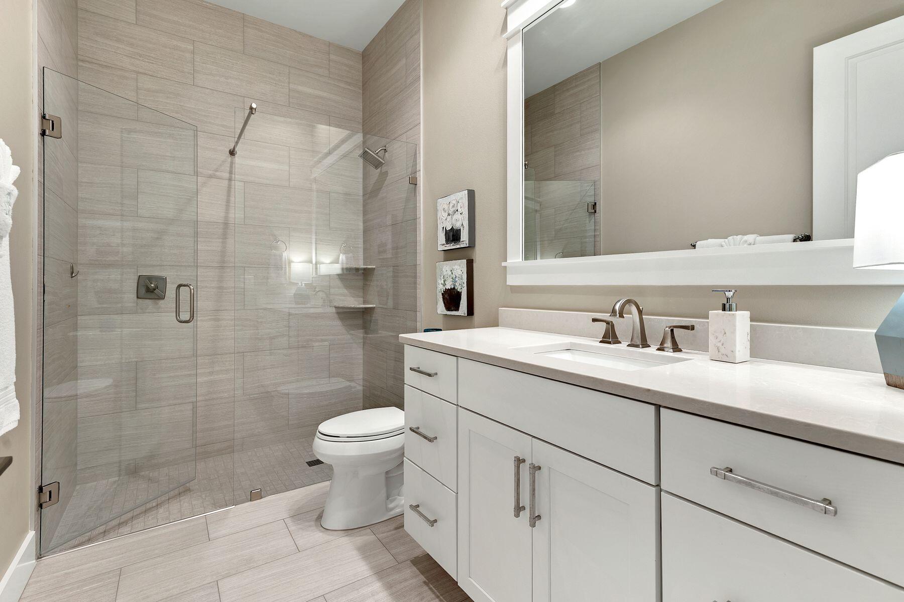 150 Medley Street Watersound, FL 32461 - Photo 16 of 30 a bathroom with a granite countertop sink a toilet and shower