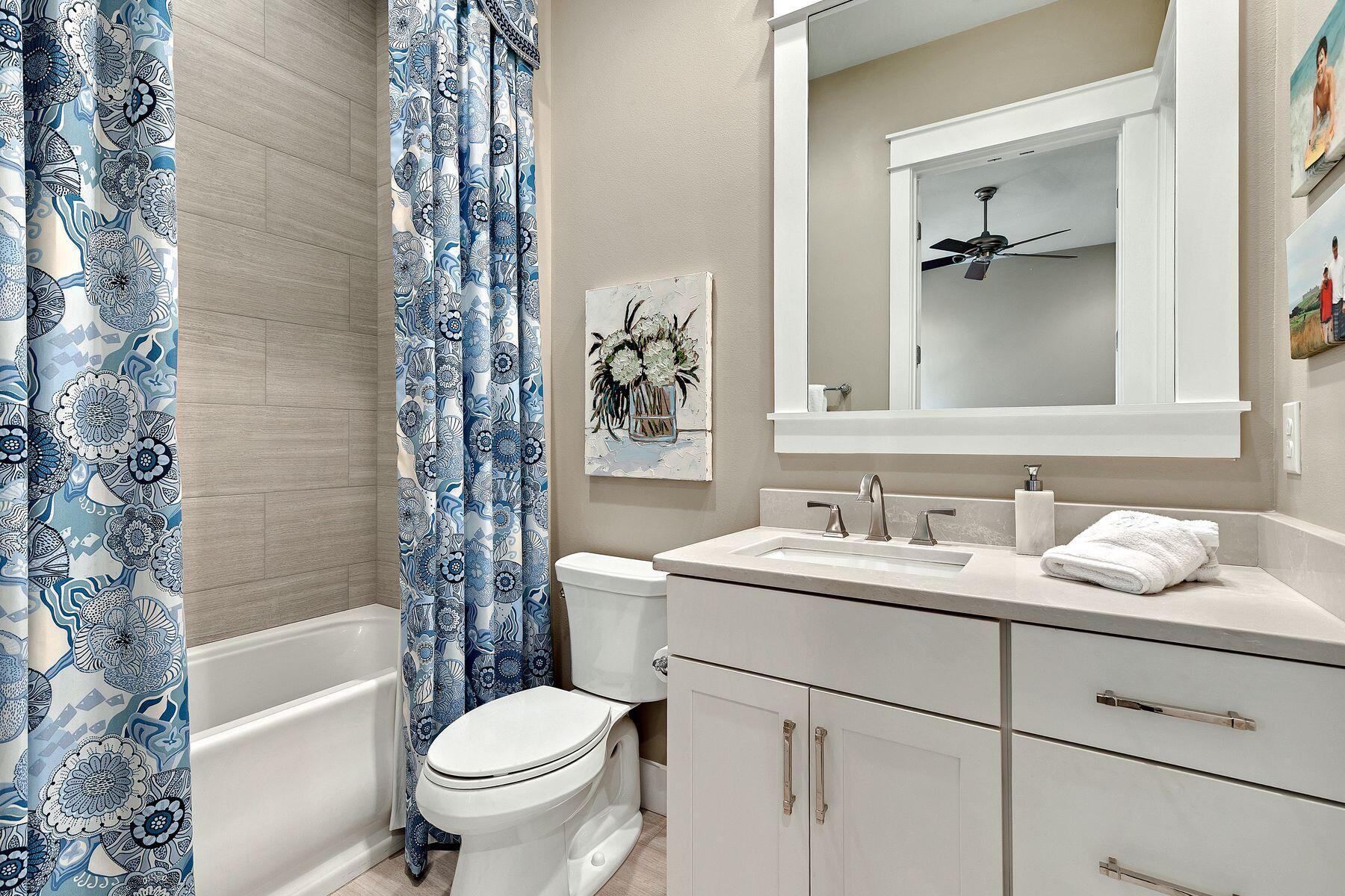 150 Medley Street Watersound, FL 32461 - Photo 18 of 30 a bathroom with a sink toilet and shower