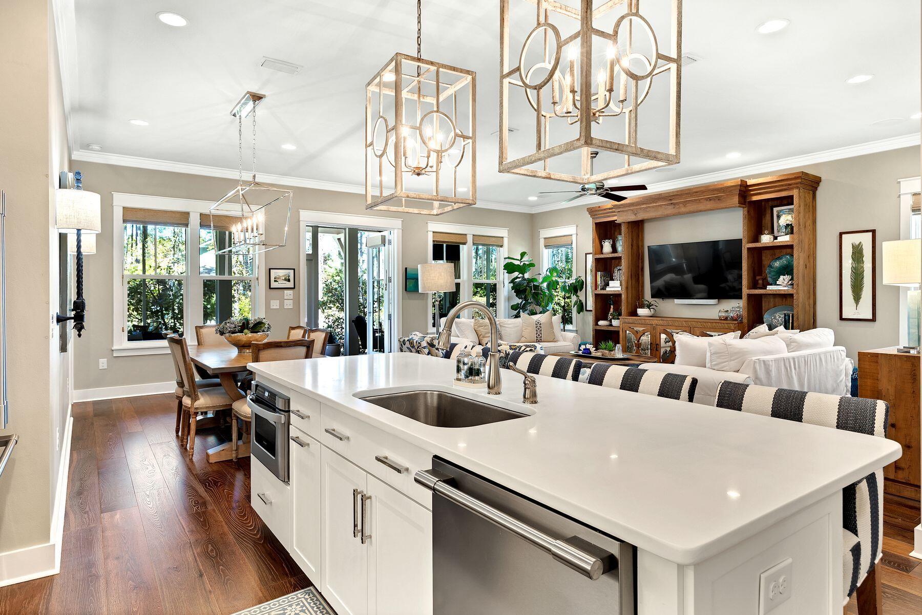 150 Medley Street Watersound, FL 32461 - Photo 5 of 30 a kitchen with a table chairs and a chandelier
