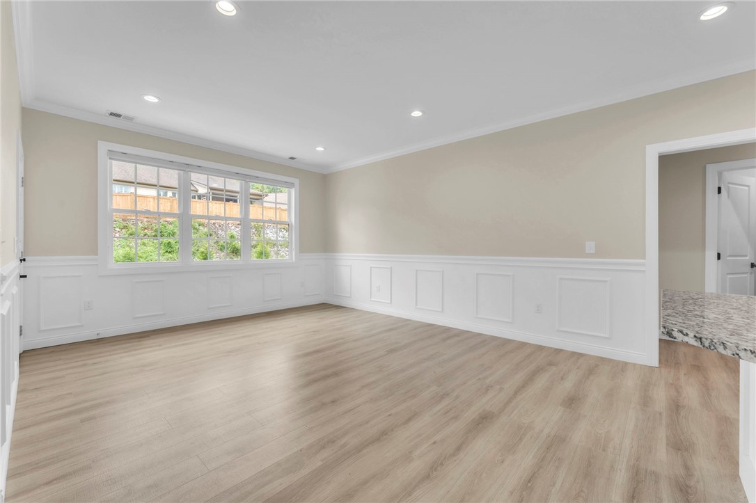 1015 Winmar Drive Anderson, SC 29621 - Photo 9 of 49 This bright, spacious living area features elegant wainscoting and abundant natural light, creating an inviting ambiance.