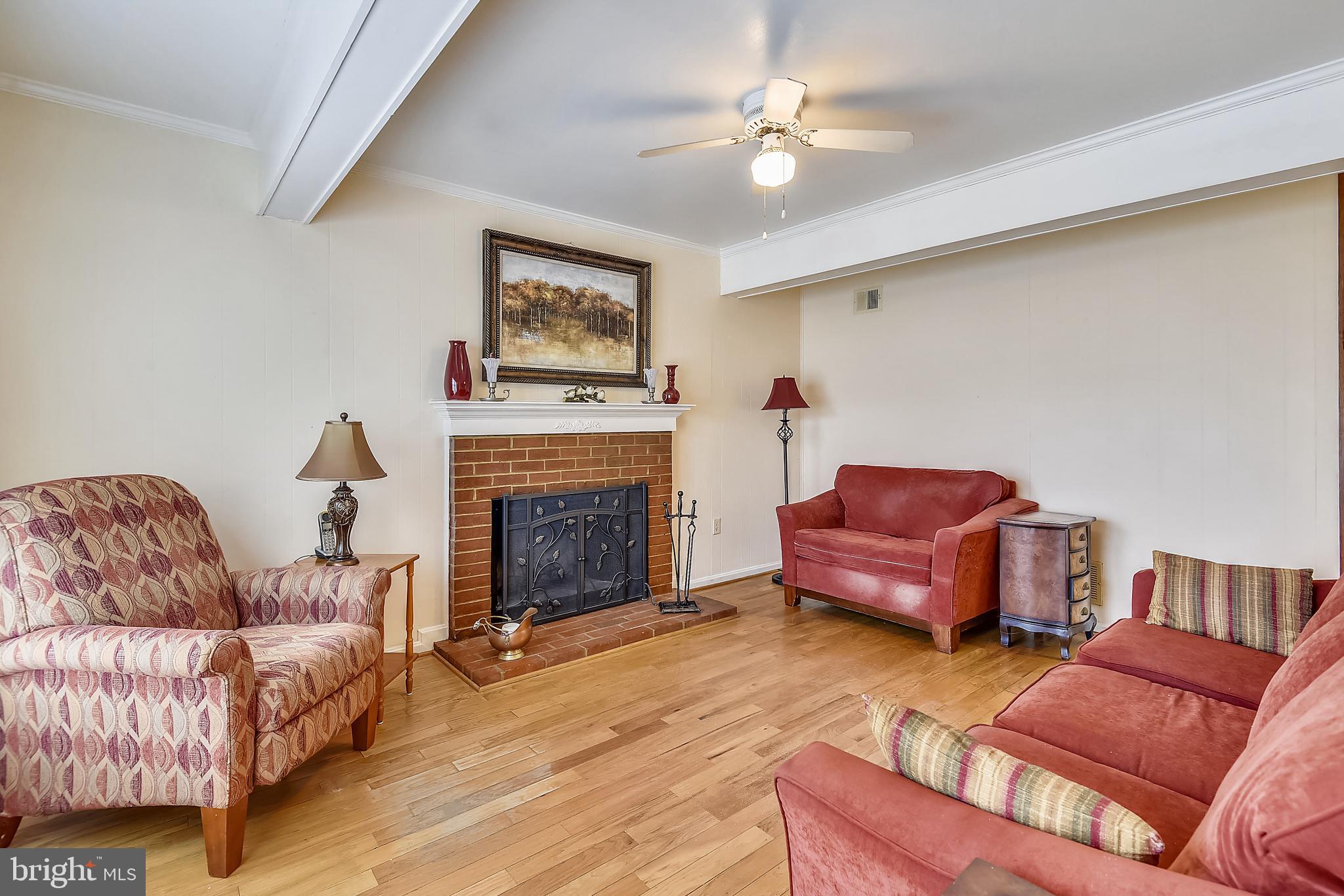6807 Ben Franklin Road Springfield, VA 22150 - Photo 14 of 52 Family room with a wood burning fireplace