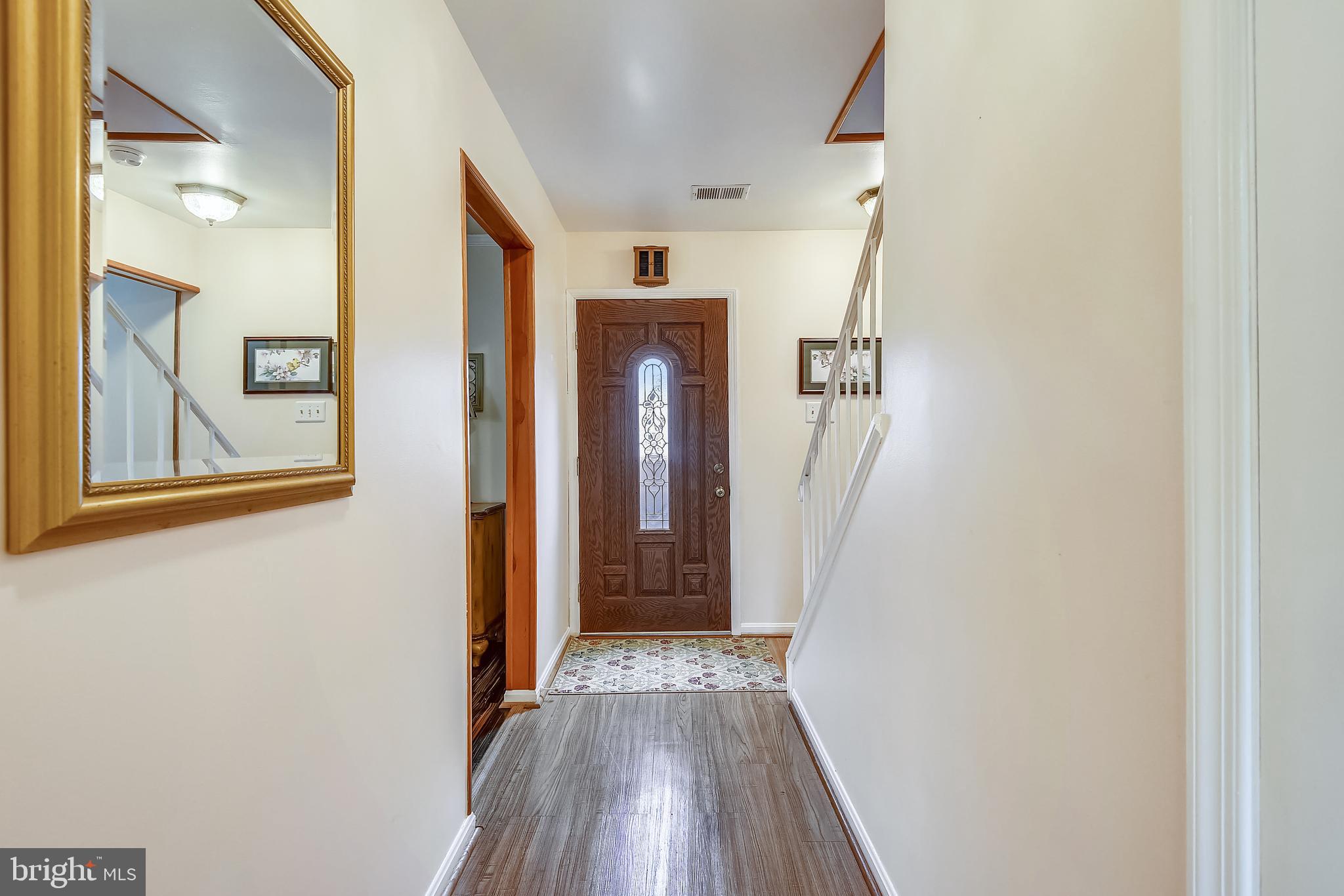 6807 Ben Franklin Road Springfield, VA 22150 - Photo 2 of 52 Center hall foyer