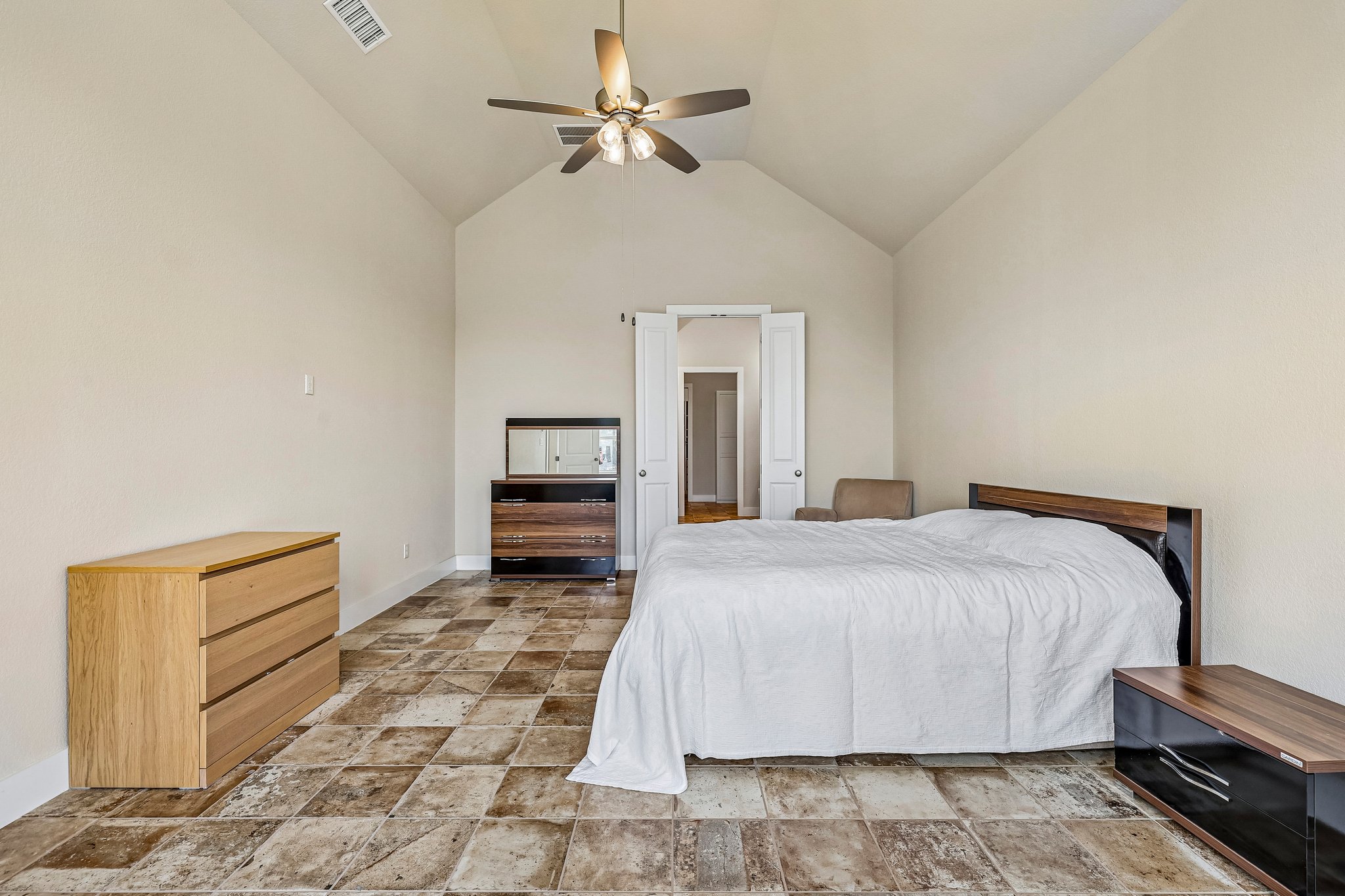 1705 Parten Rnch Parkway Austin, TX 78737 - Photo 23 of 39 High vaulted ceilings create an open, airy feel in this comfortable bedroom.