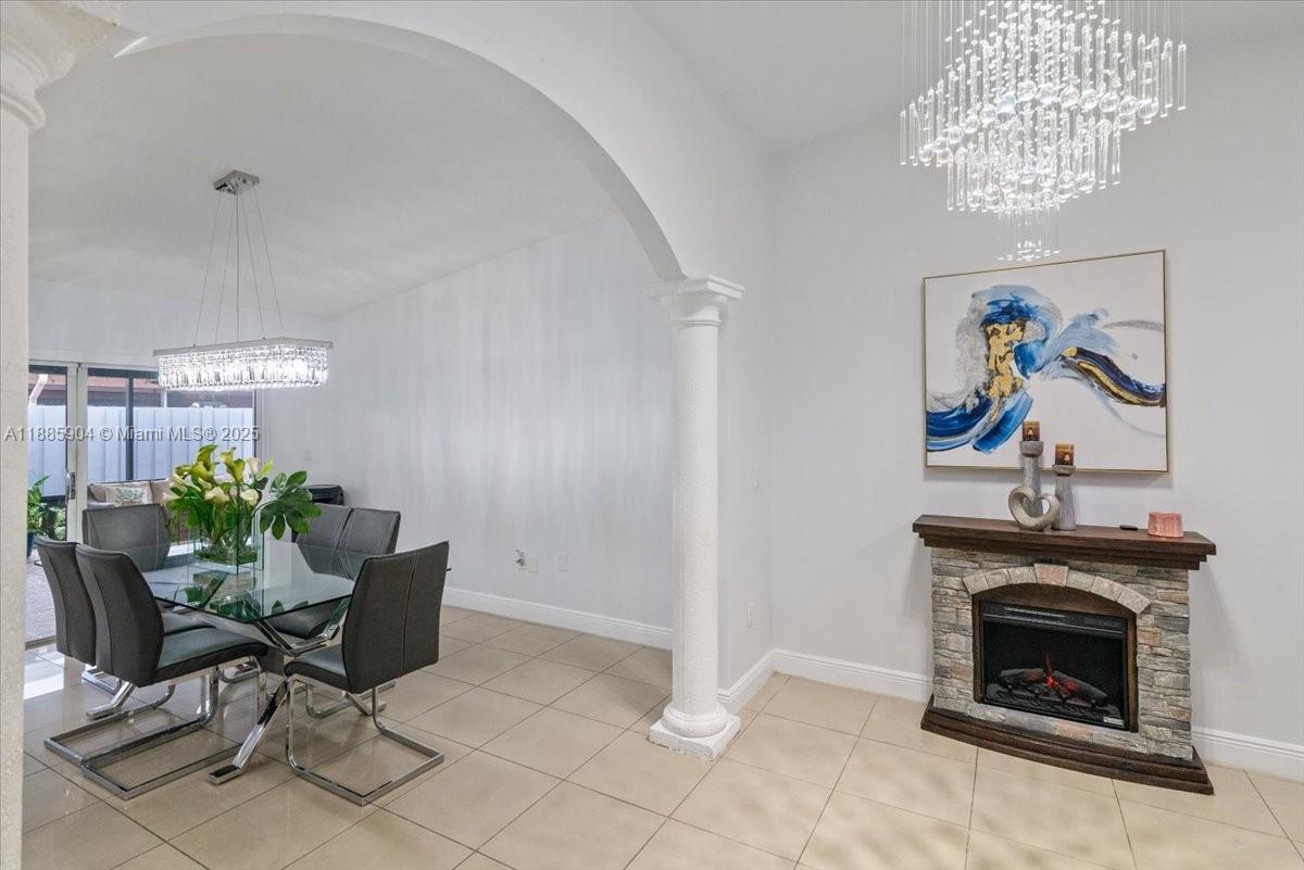 14500 Southwest 173rd Street Miami, FL 33177 - Photo 11 of 47 a living room with furniture and a fireplace