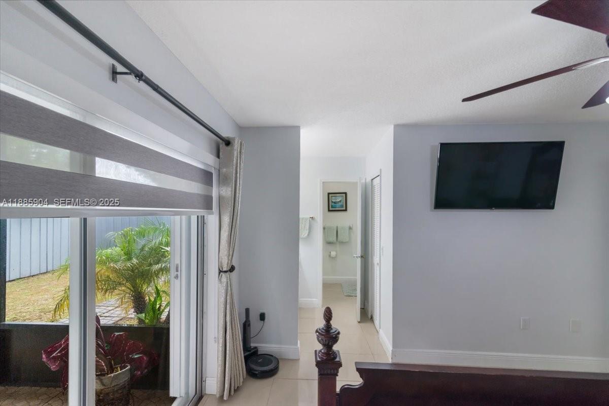 14500 Southwest 173rd Street Miami, FL 33177 - Photo 30 of 47 a living room with furniture and a flat screen tv