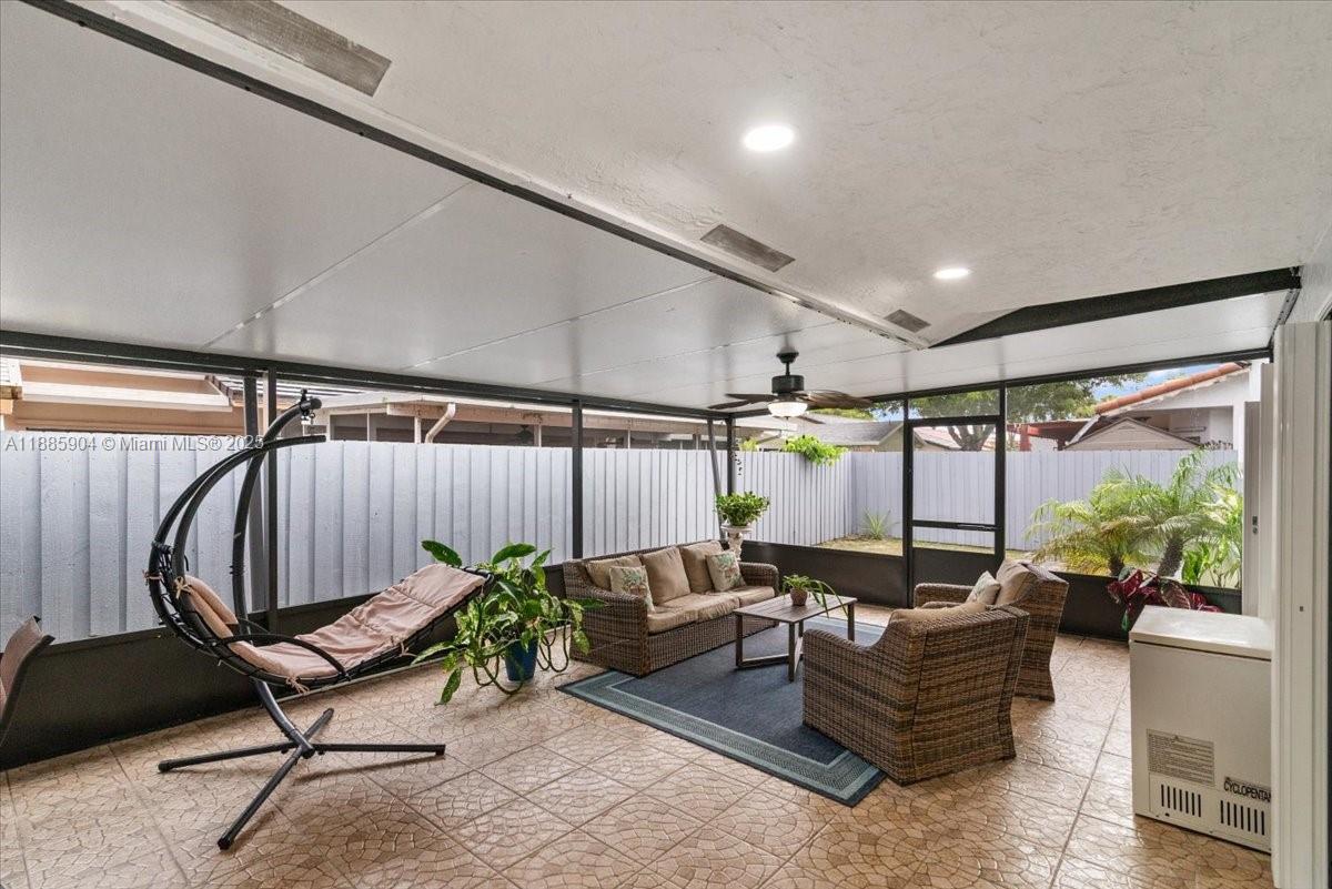 14500 Southwest 173rd Street Miami, FL 33177 - Photo 34 of 47 a living room with furniture and a potted plant