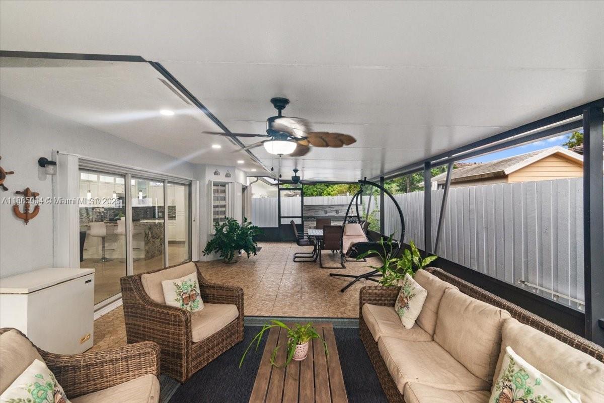 14500 Southwest 173rd Street Miami, FL 33177 - Photo 35 of 47 a living room with furniture and a large window
