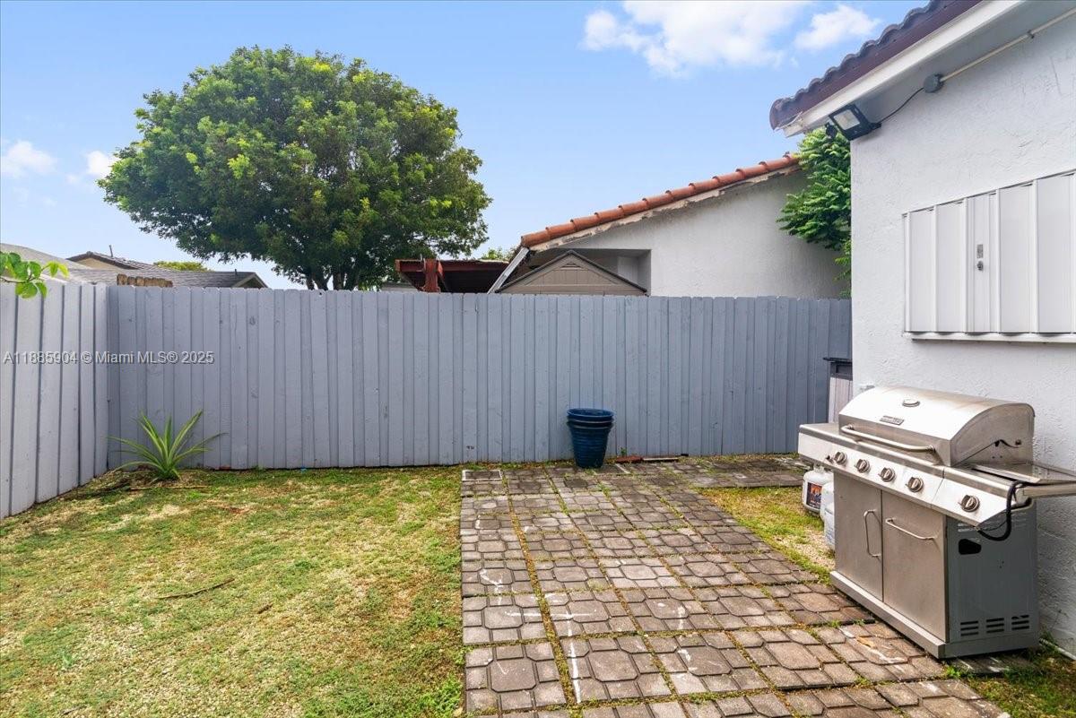14500 Southwest 173rd Street Miami, FL 33177 - Photo 39 of 47 a view of a backyard with wooden fence