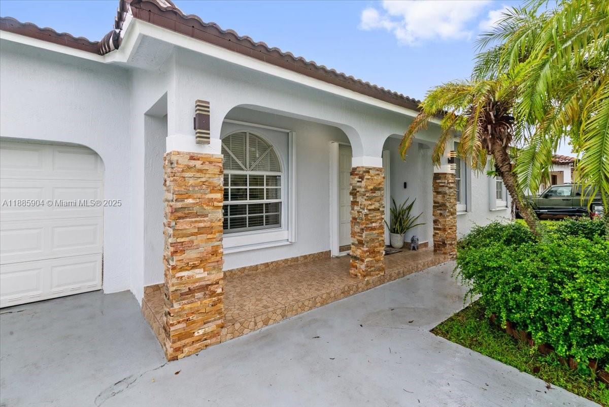 14500 Southwest 173rd Street Miami, FL 33177 - Photo 43 of 47 front view of a house with a street
