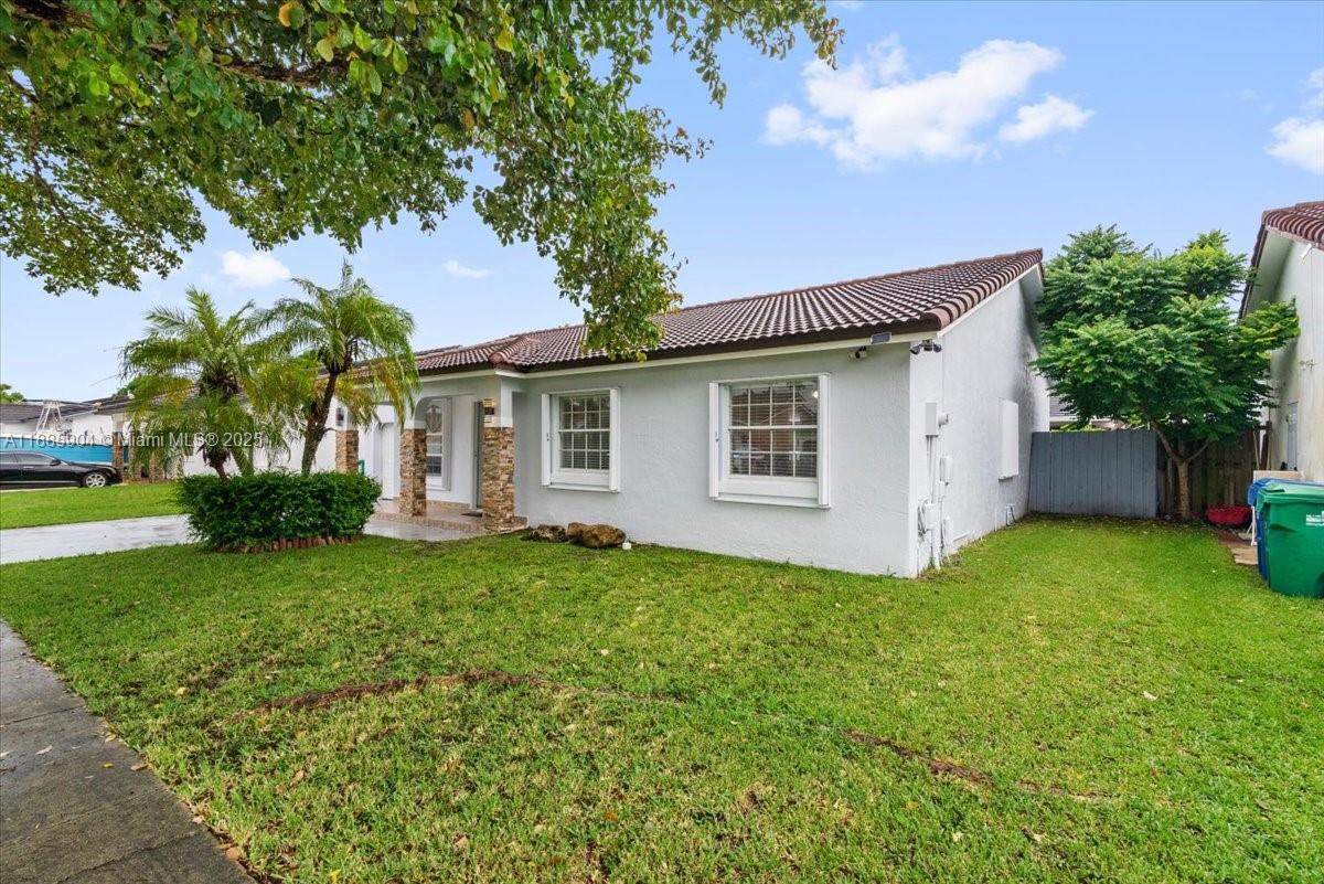 14500 Southwest 173rd Street Miami, FL 33177 - Photo 44 of 47 a view of a house with backyard and garden