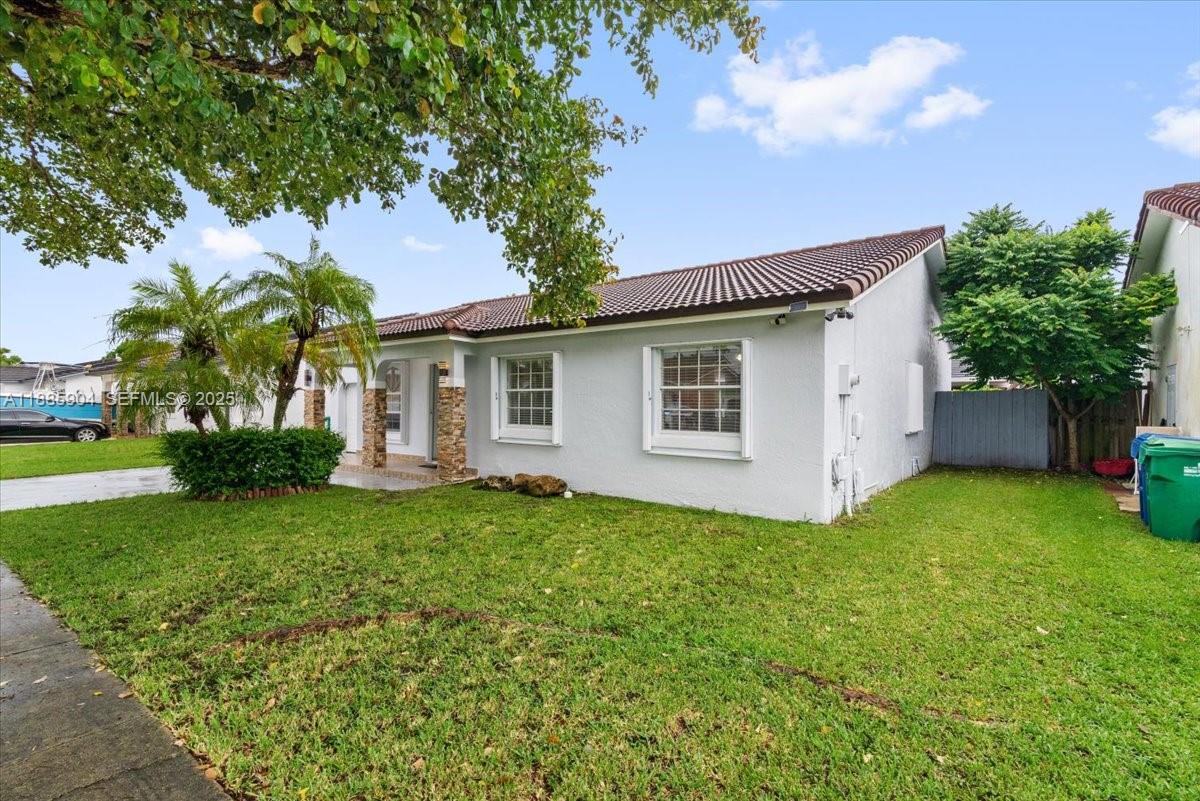 14500 Southwest 173rd Street Miami, FL 33177 - Photo 44 of 47 a view of a house with backyard and garden