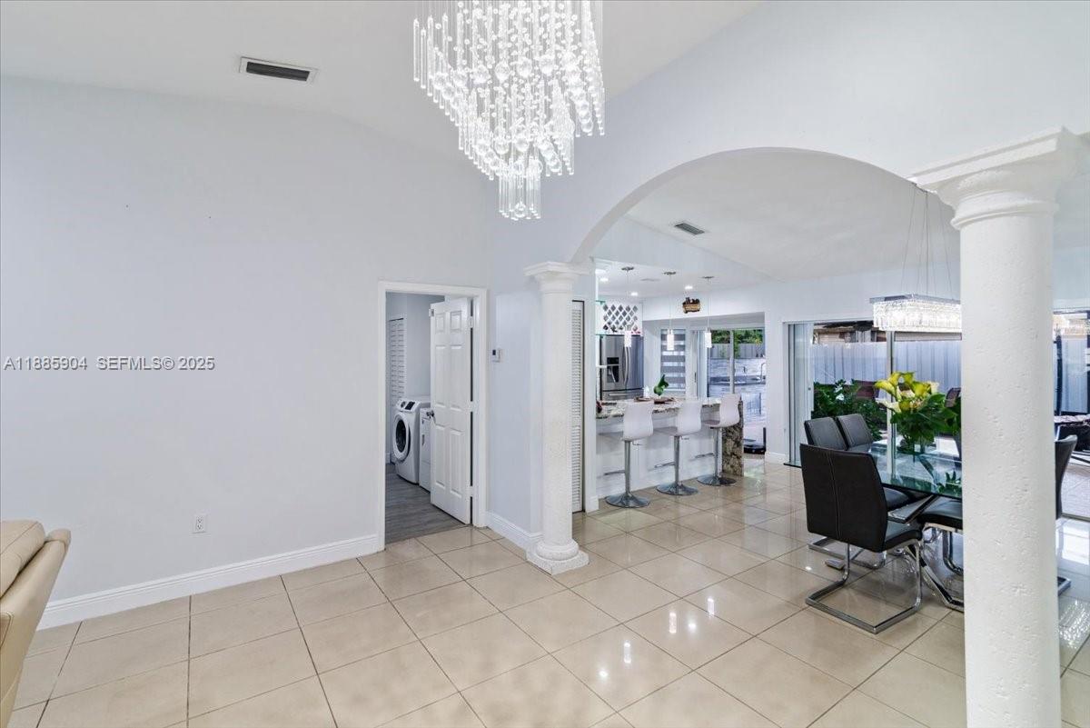 14500 Southwest 173rd Street Miami, FL 33177 - Photo 8 of 47 a view of livingroom with workspace and a window